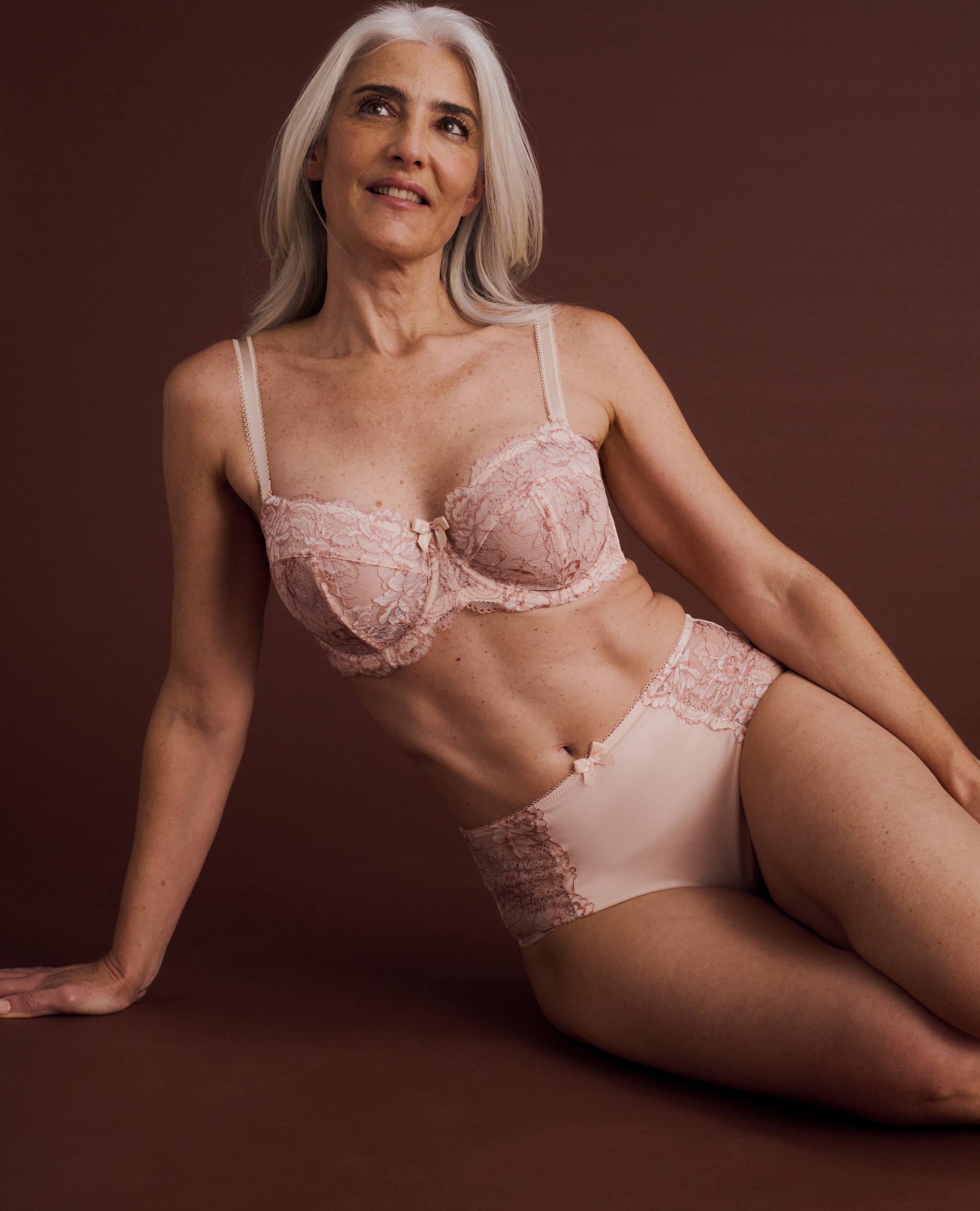 Lady wearing matching blush coloured lingerie