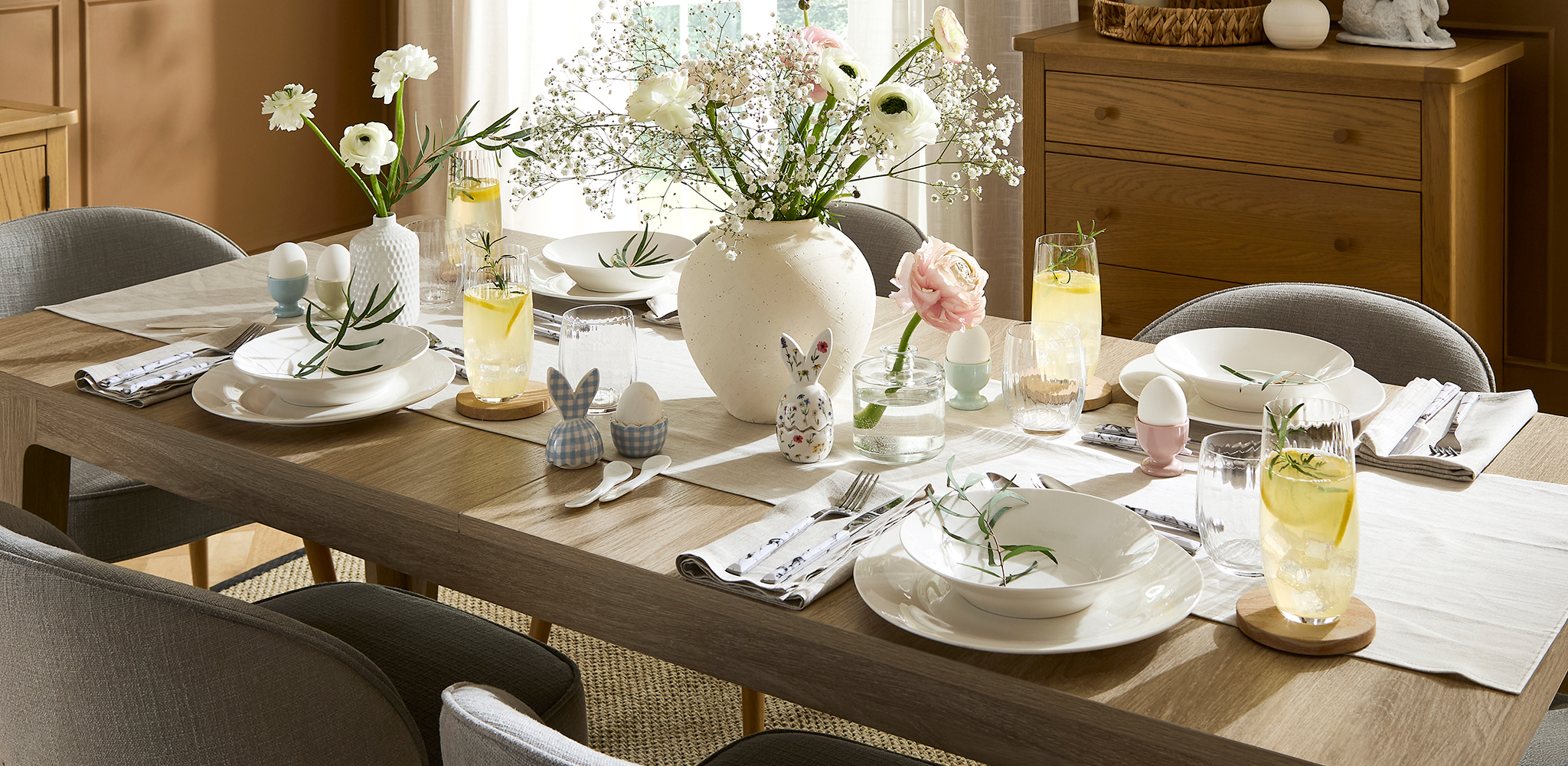 A dining table all set up for an Easter meal.