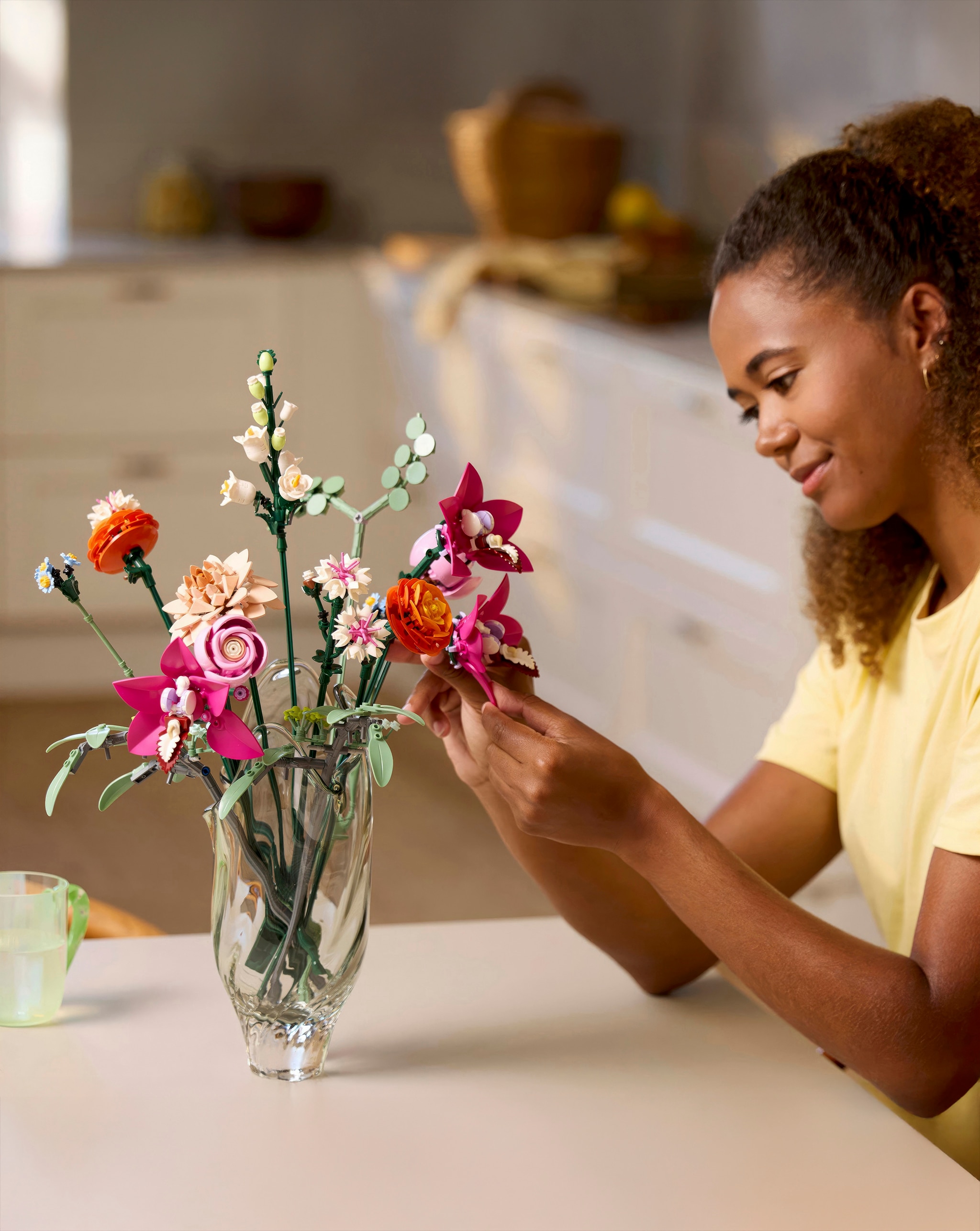 Girl playing with LEGO® flowers
