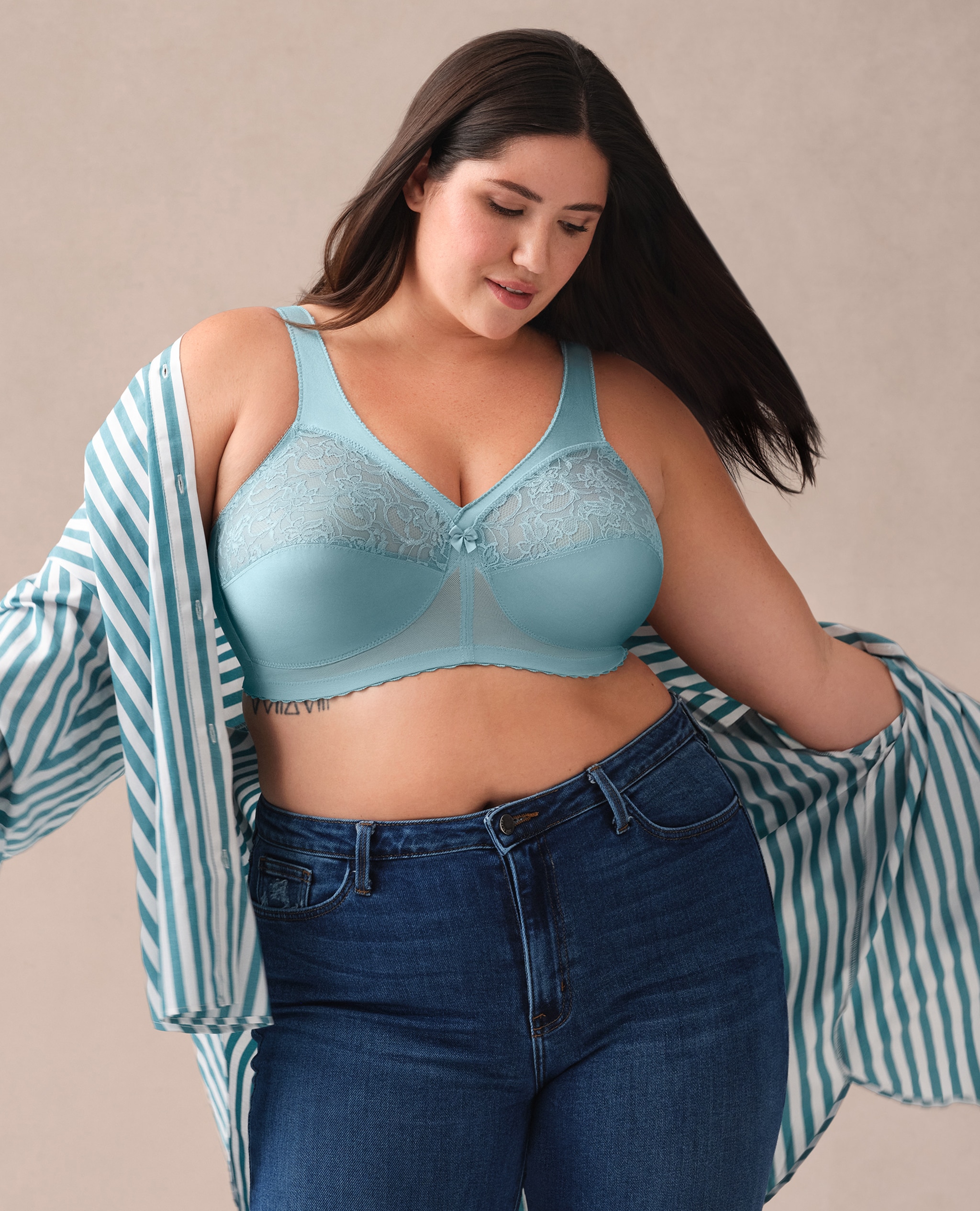 Model wears Glamorise Plus Size MagicLift Original Support Bra 1000 With jeans and shirt
