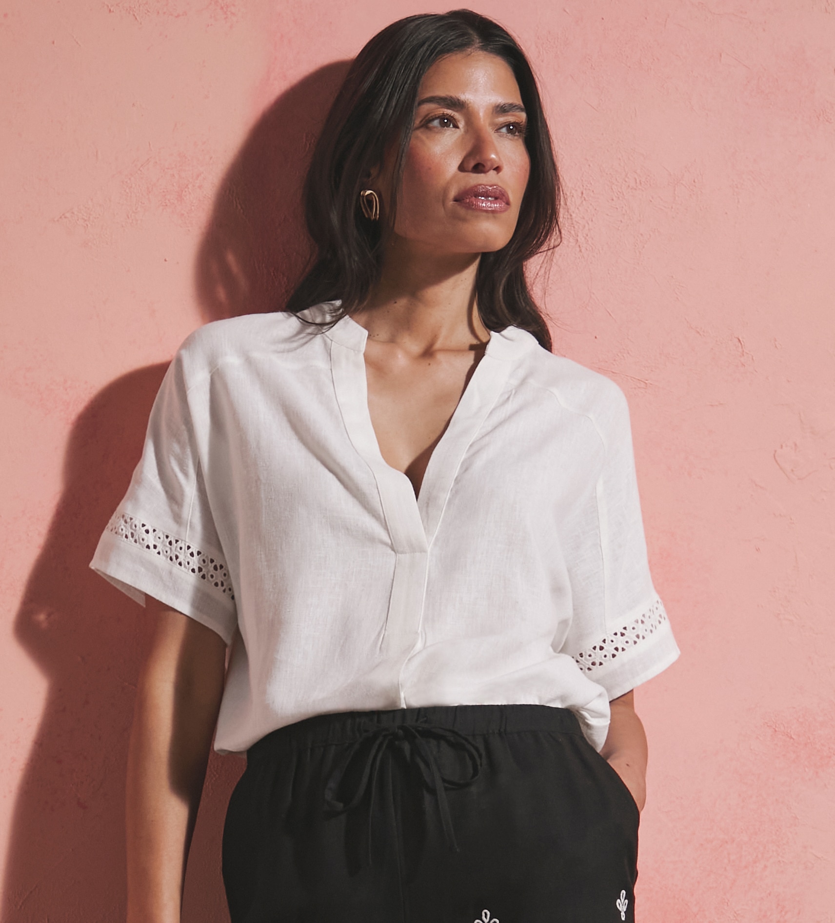 Lady wearing white linen shirt