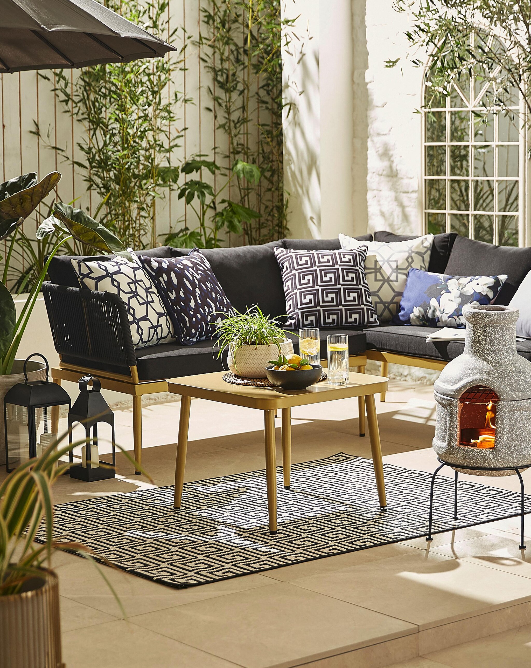 Selection of outdoor garden furniture, tables and heating.