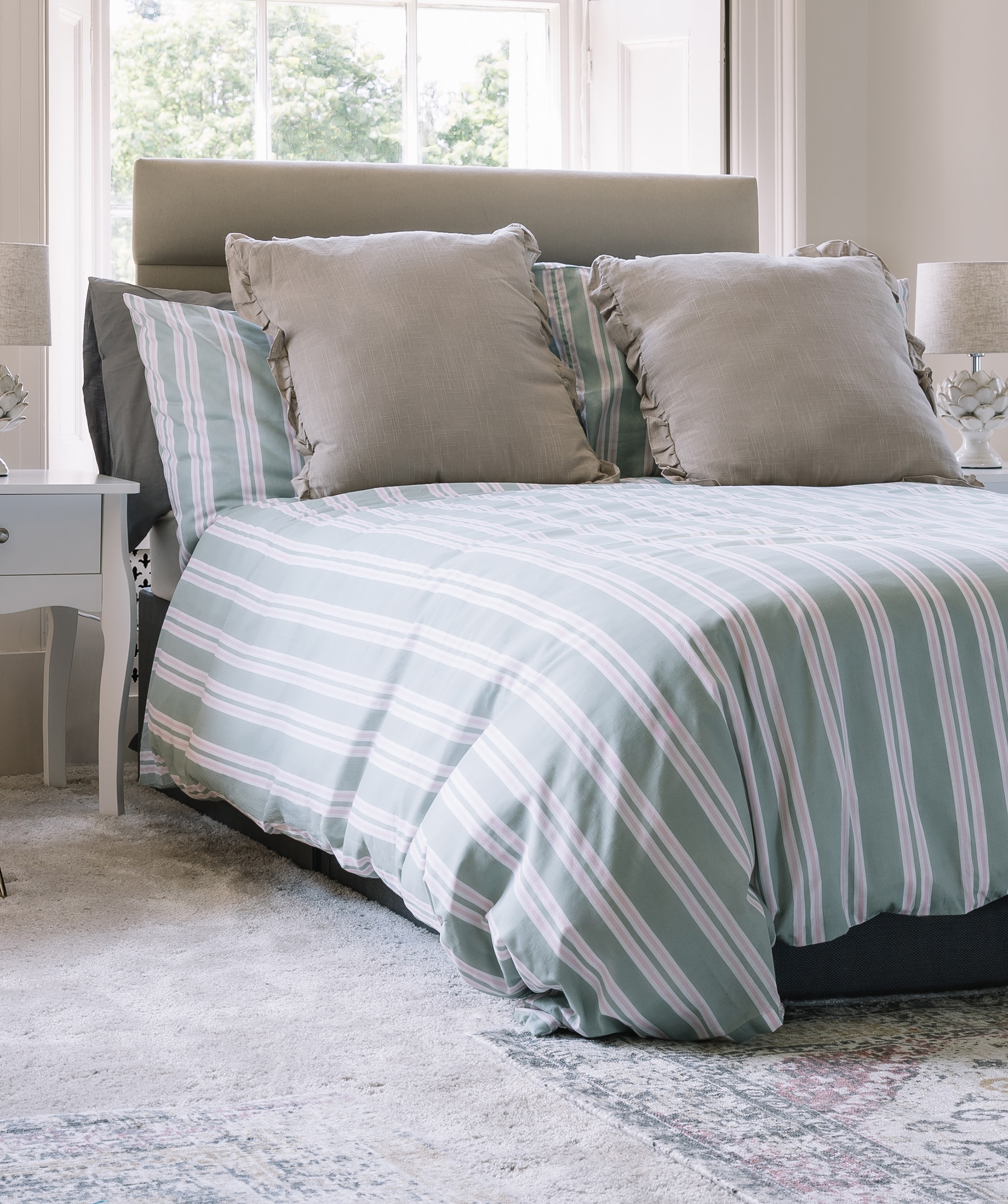 A strip duvet set on a double bed