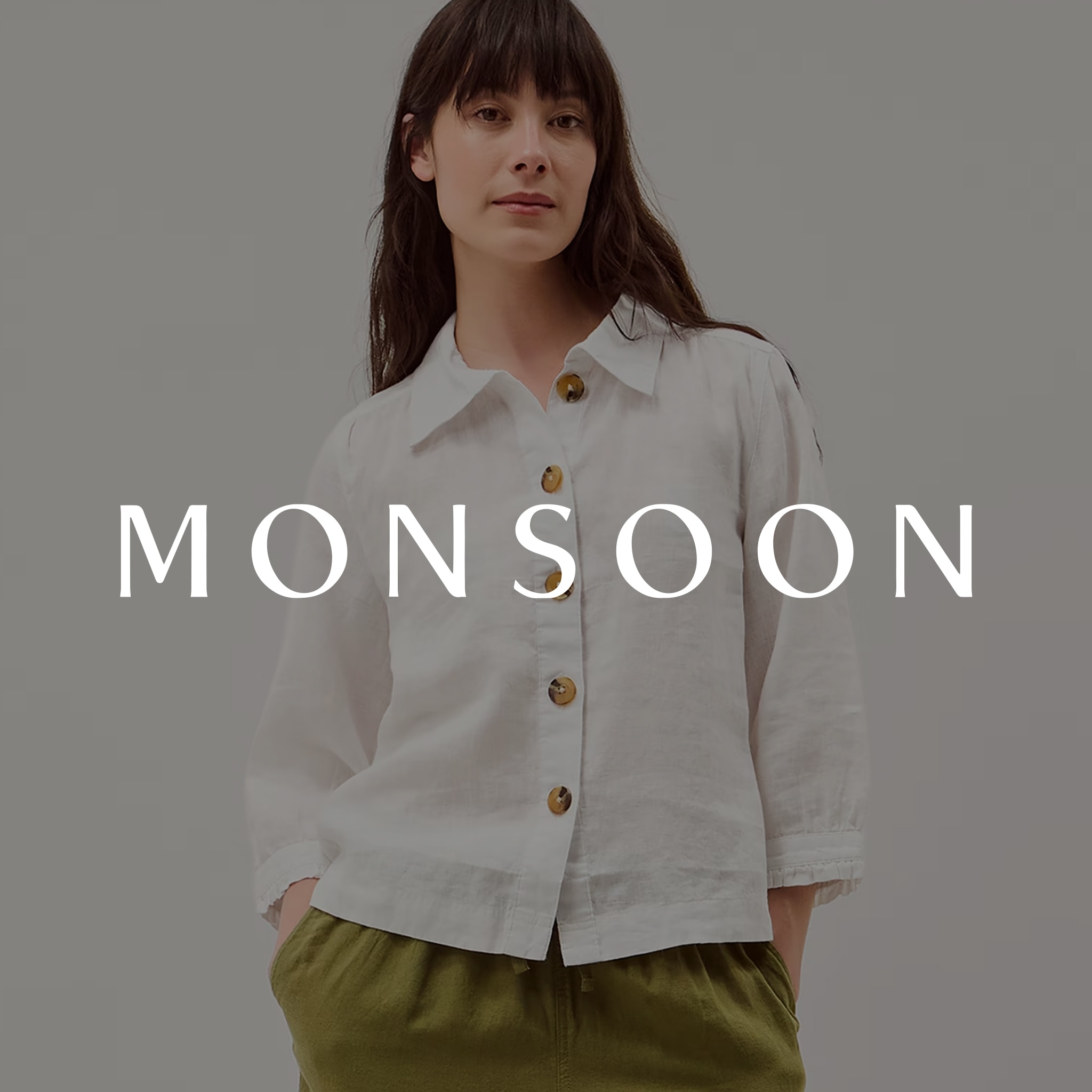 A lady wearing a white Monsoon blouse. The Monsoon logo is overlaid on the image.