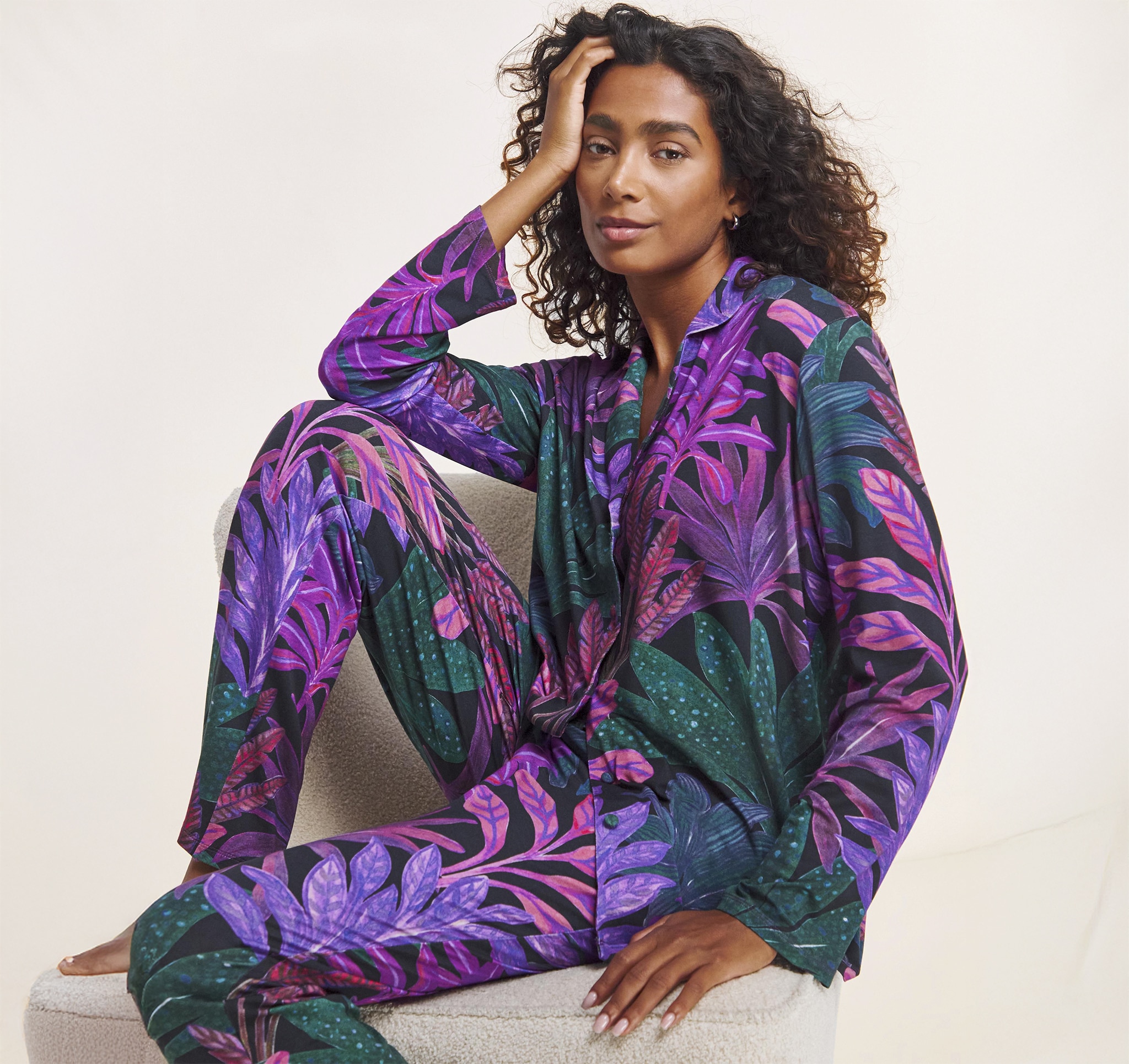 Lady sat down wearing purple loungewear