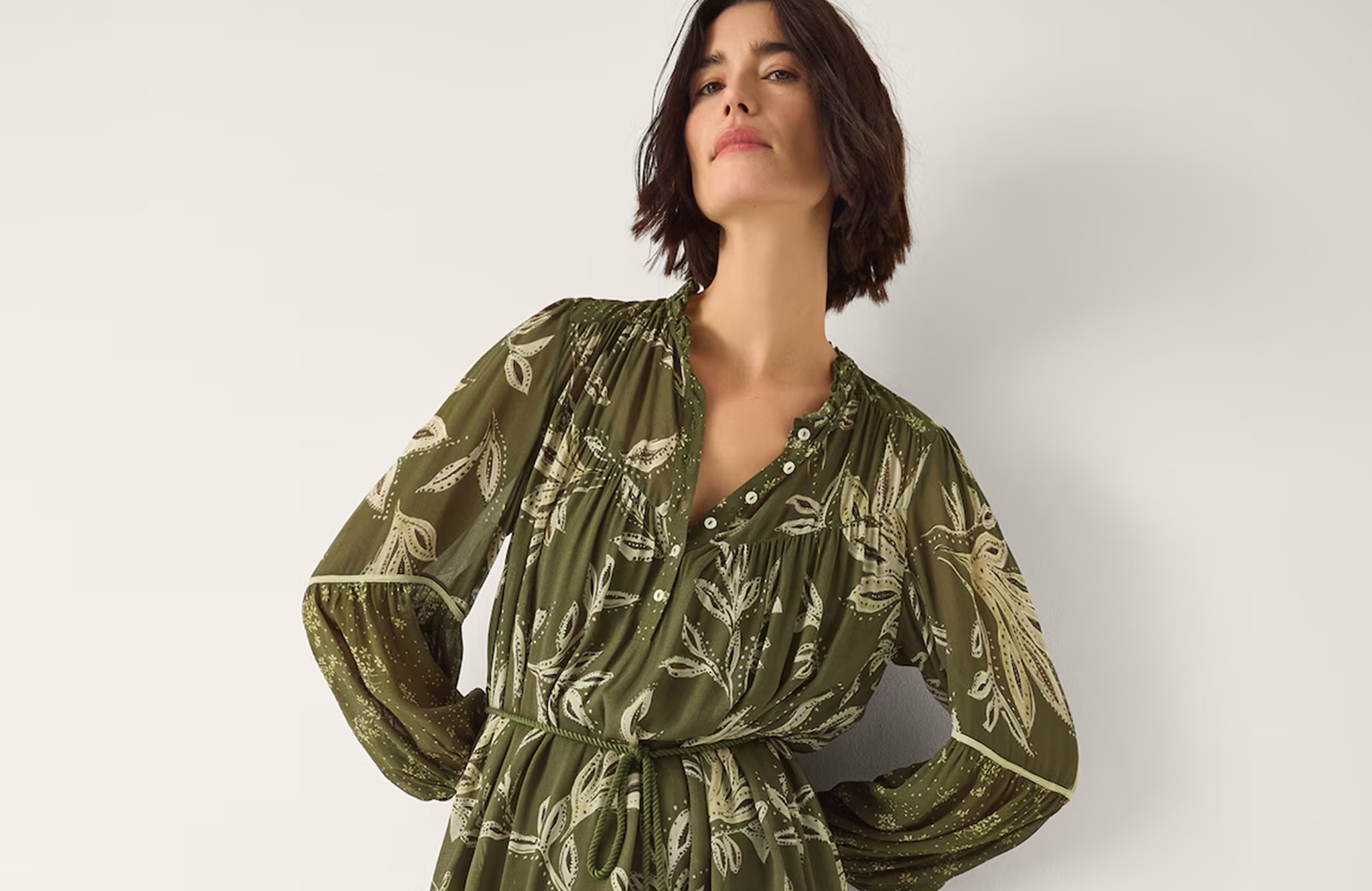 Model is wearing a Monsoon Leona khaki printed long sleeve midi dress.