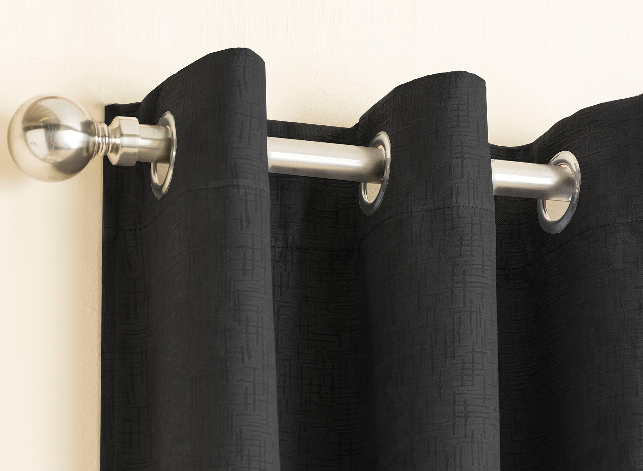 Top detail of black porthole curtains