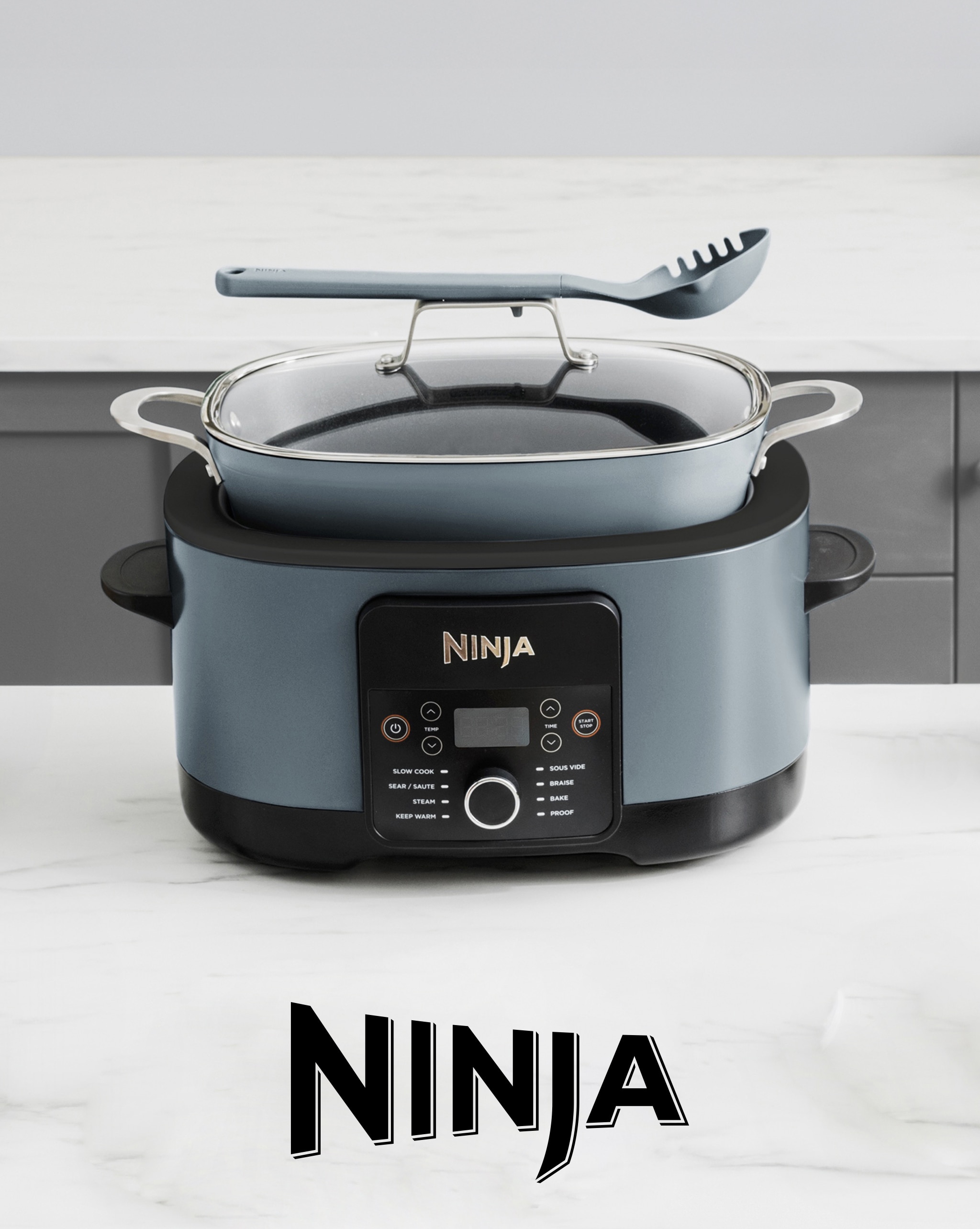 A Ninja cooking appliance on a kitchen worktop.