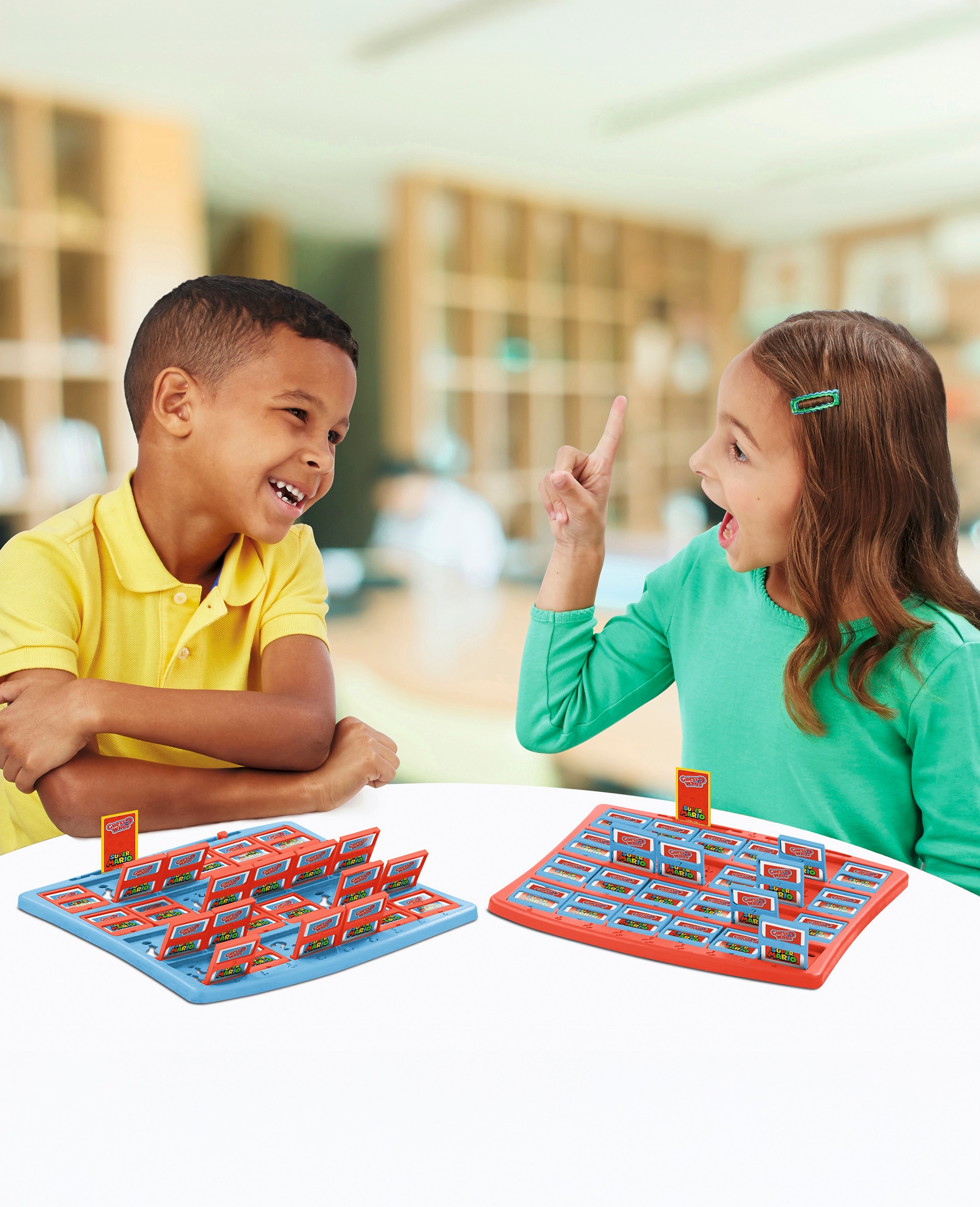 Two children playing with a board game