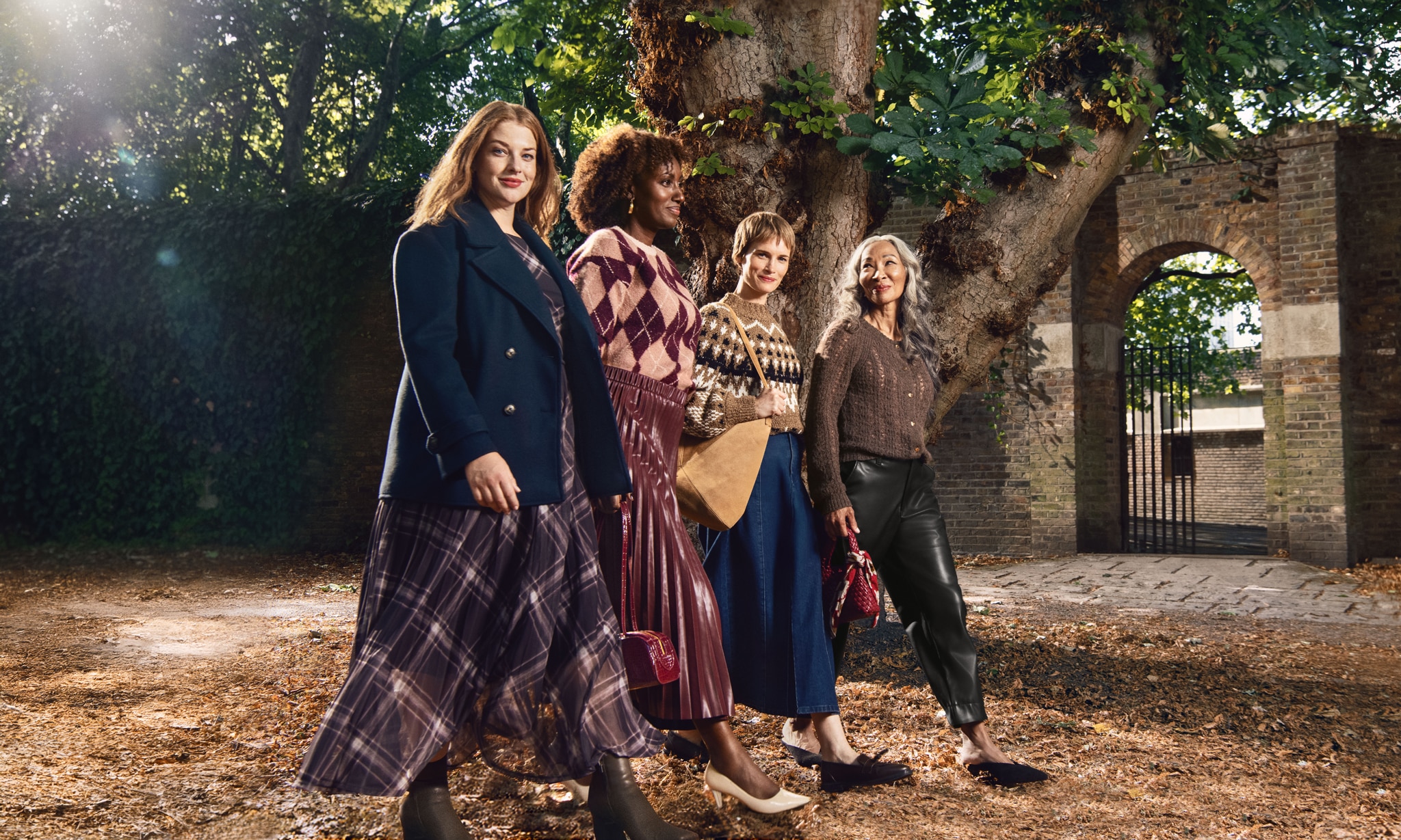 4 women wearing autumn winter clothing from JD Williams