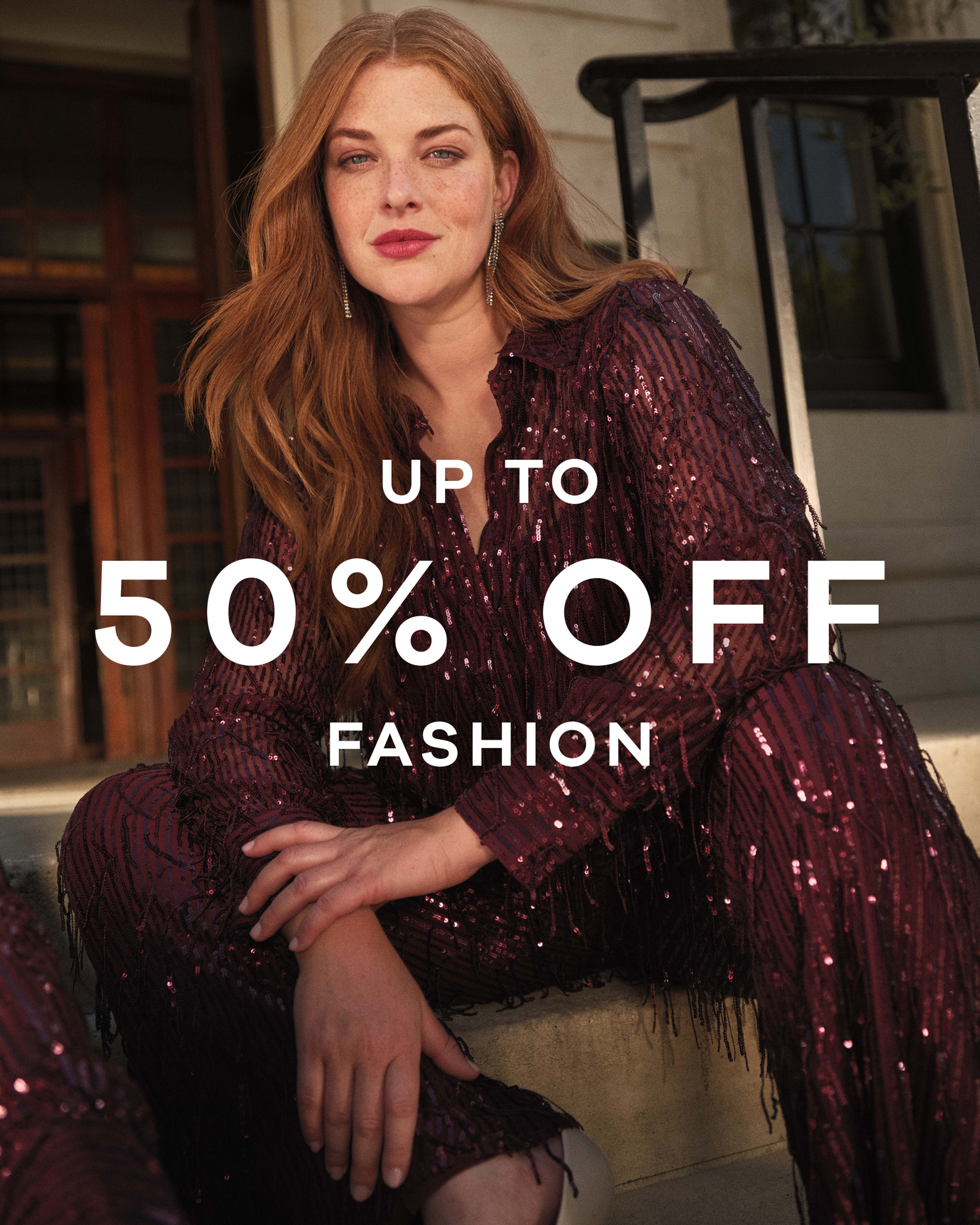 Up to 50% off fashion text overlaid on an image of a person sat down wearing a maroon glittery two piece outfit.