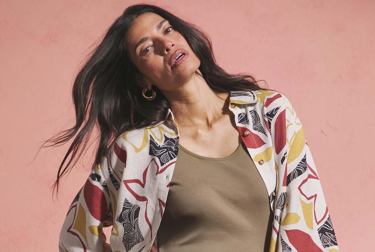 Lady wearing colour print patterned linen jacket