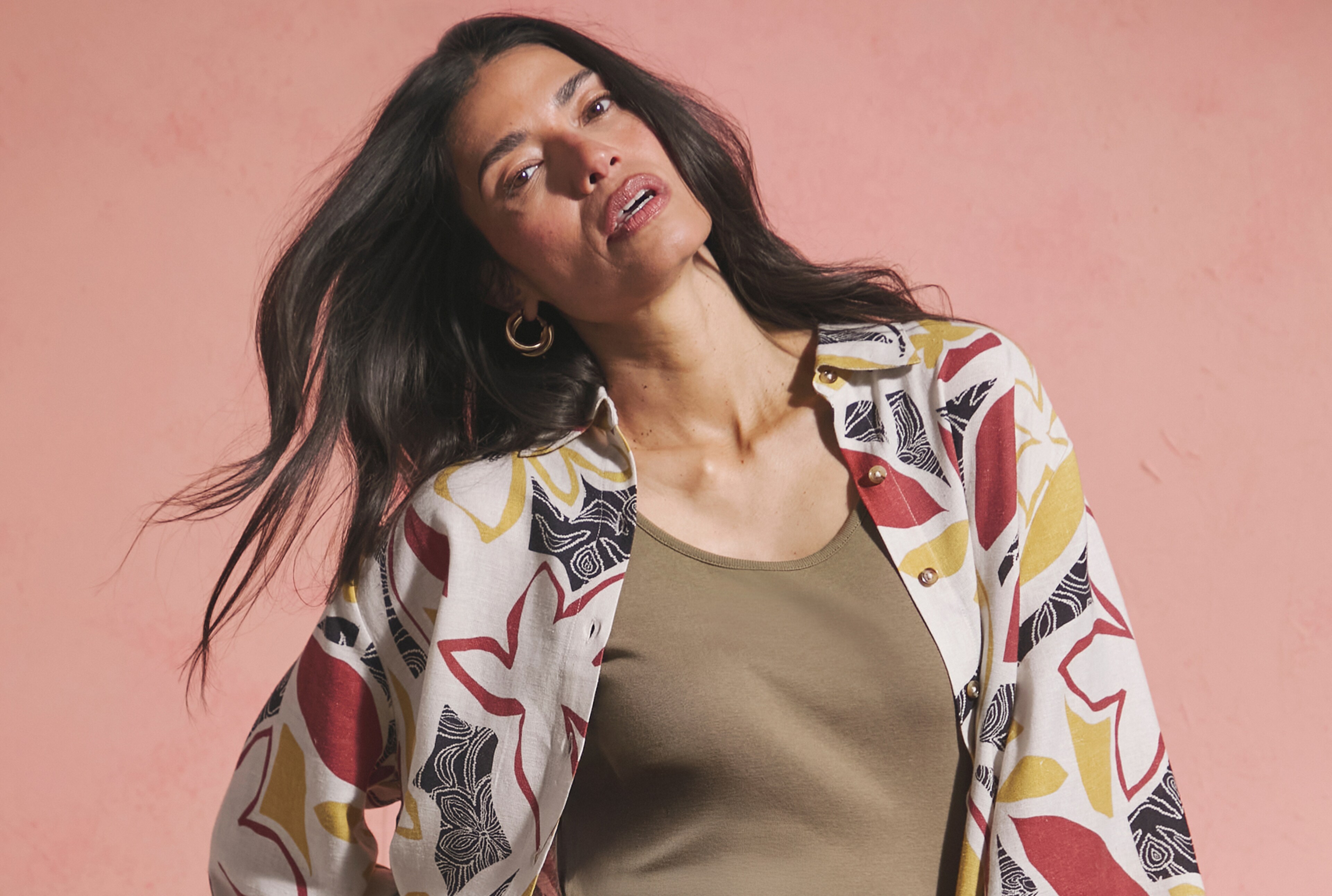 Lady wearing colour print patterned linen jacket