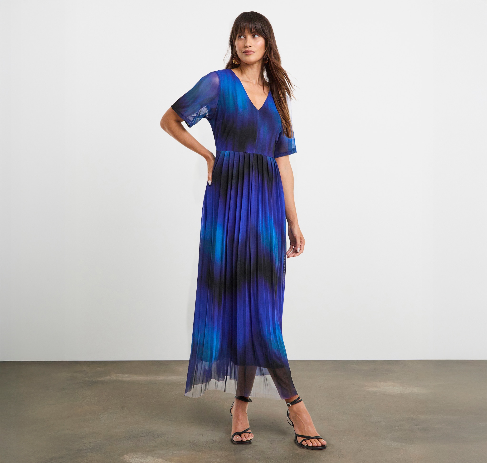 Lady wearing a vibrant blue and black dress.