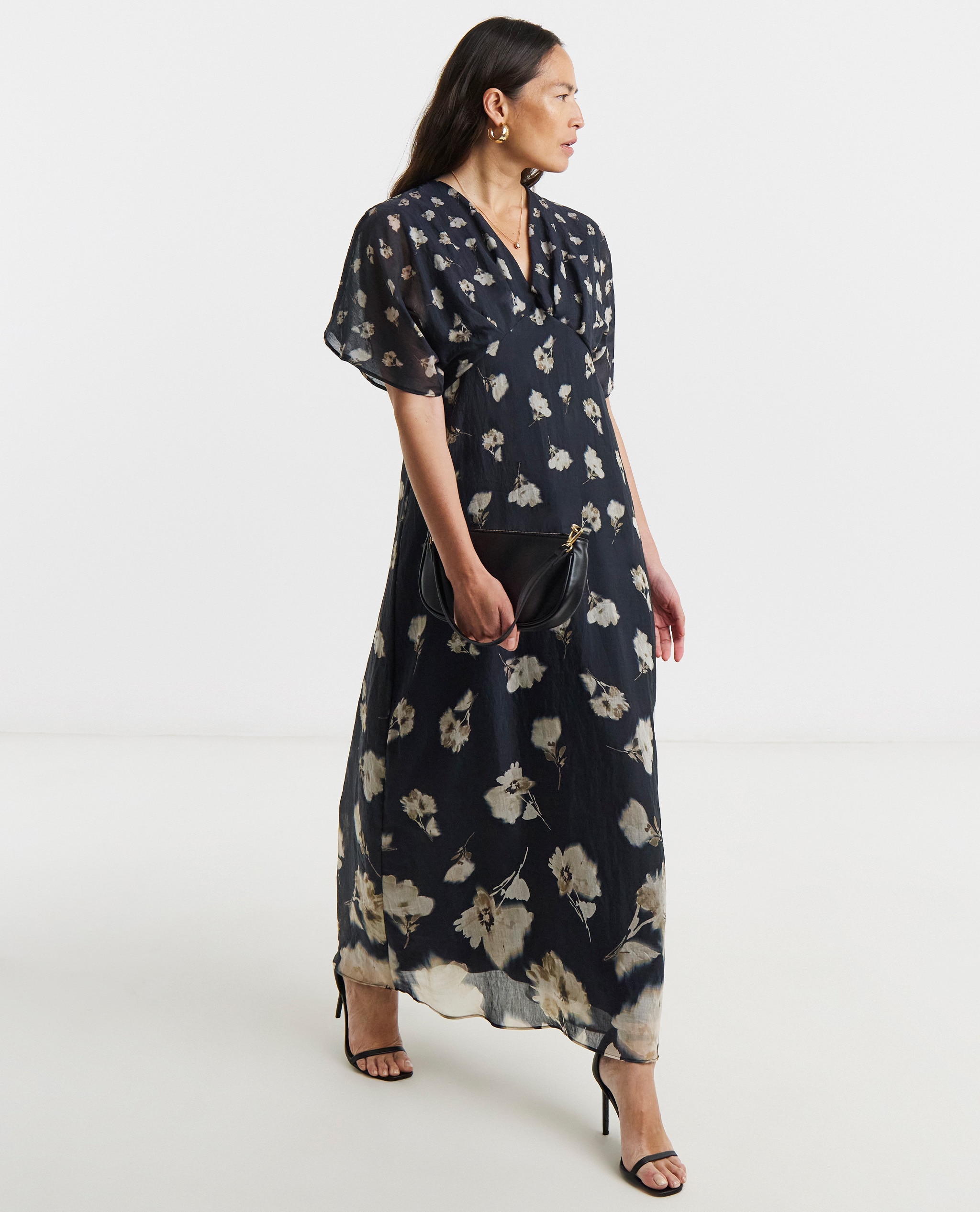 Model wearing a navy maxi dress