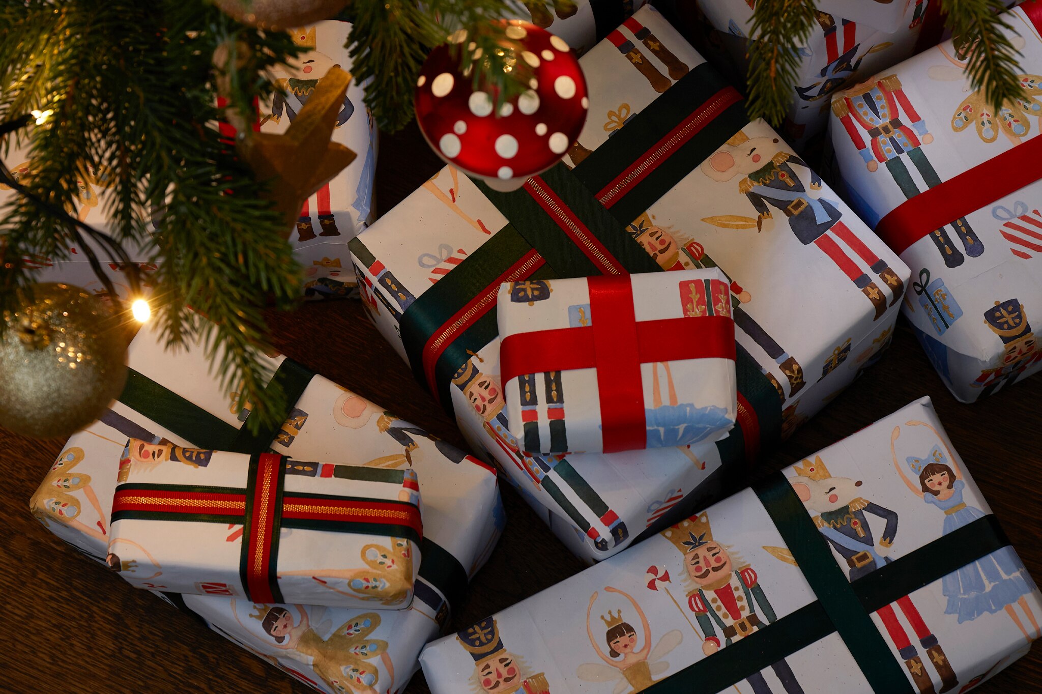 A lot of wrapped Christmas gifts under a Christmas tree