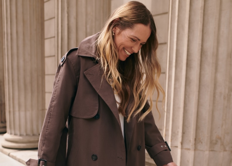 Woman wearing a chocolate trench coat