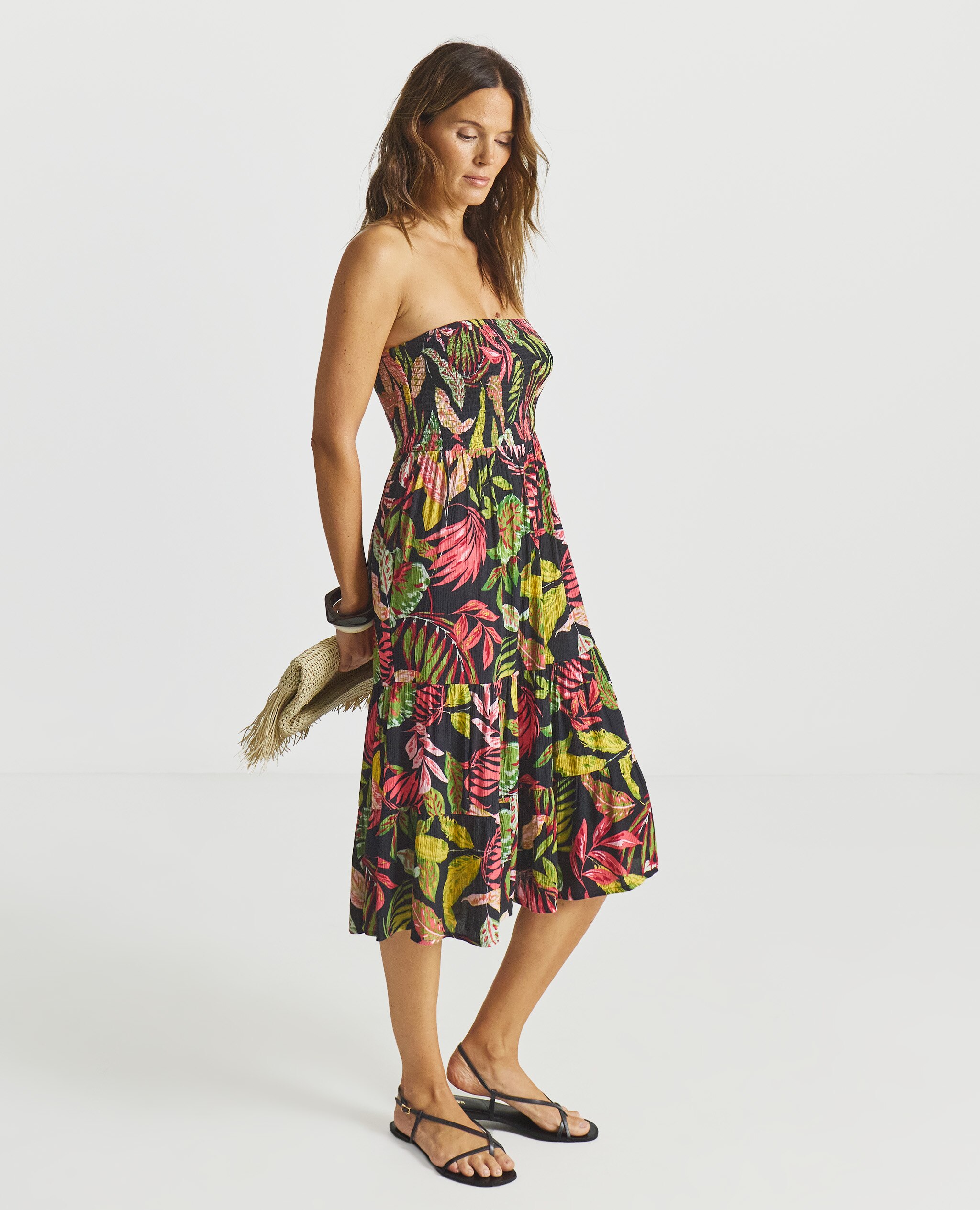 Model wearing a tropical beach dress