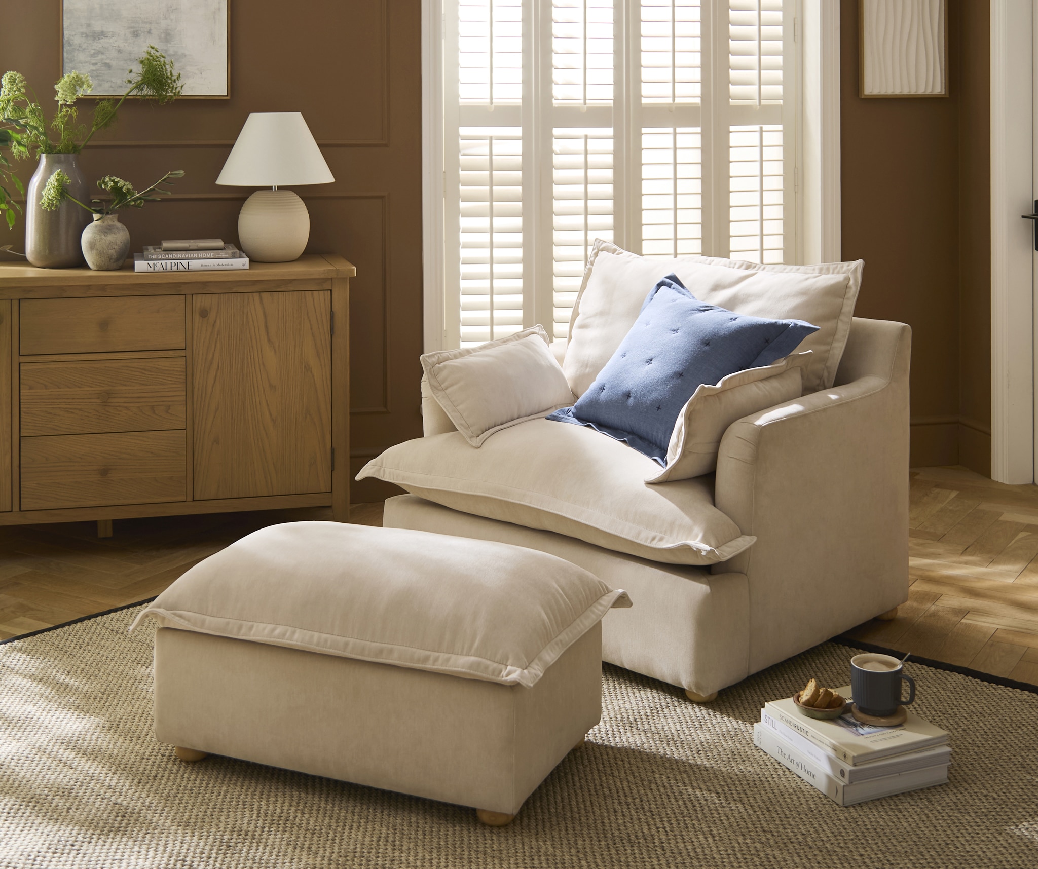 JD Williams accent chair and foot stool in a living room