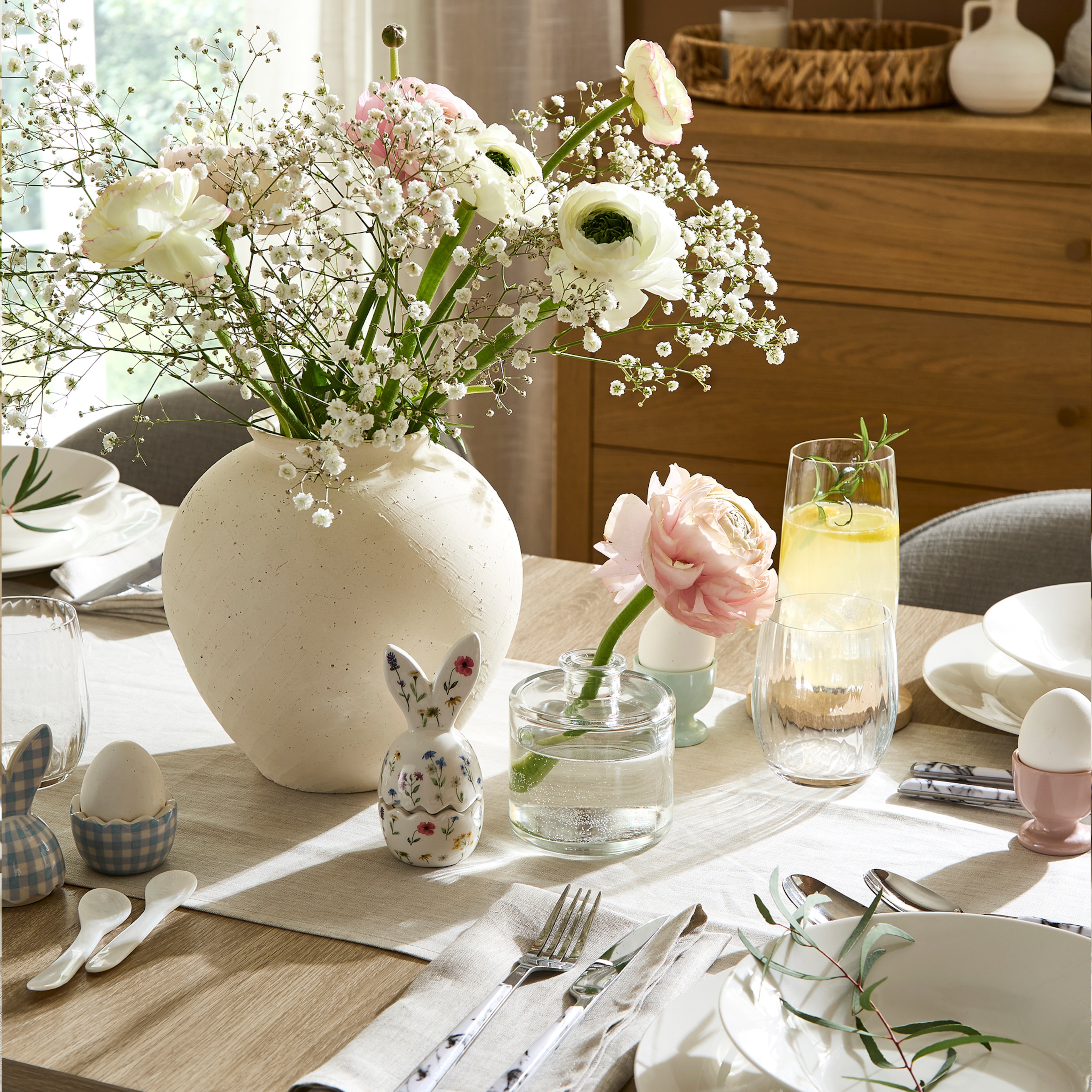 An Easter themed dining table set up for a gathering.