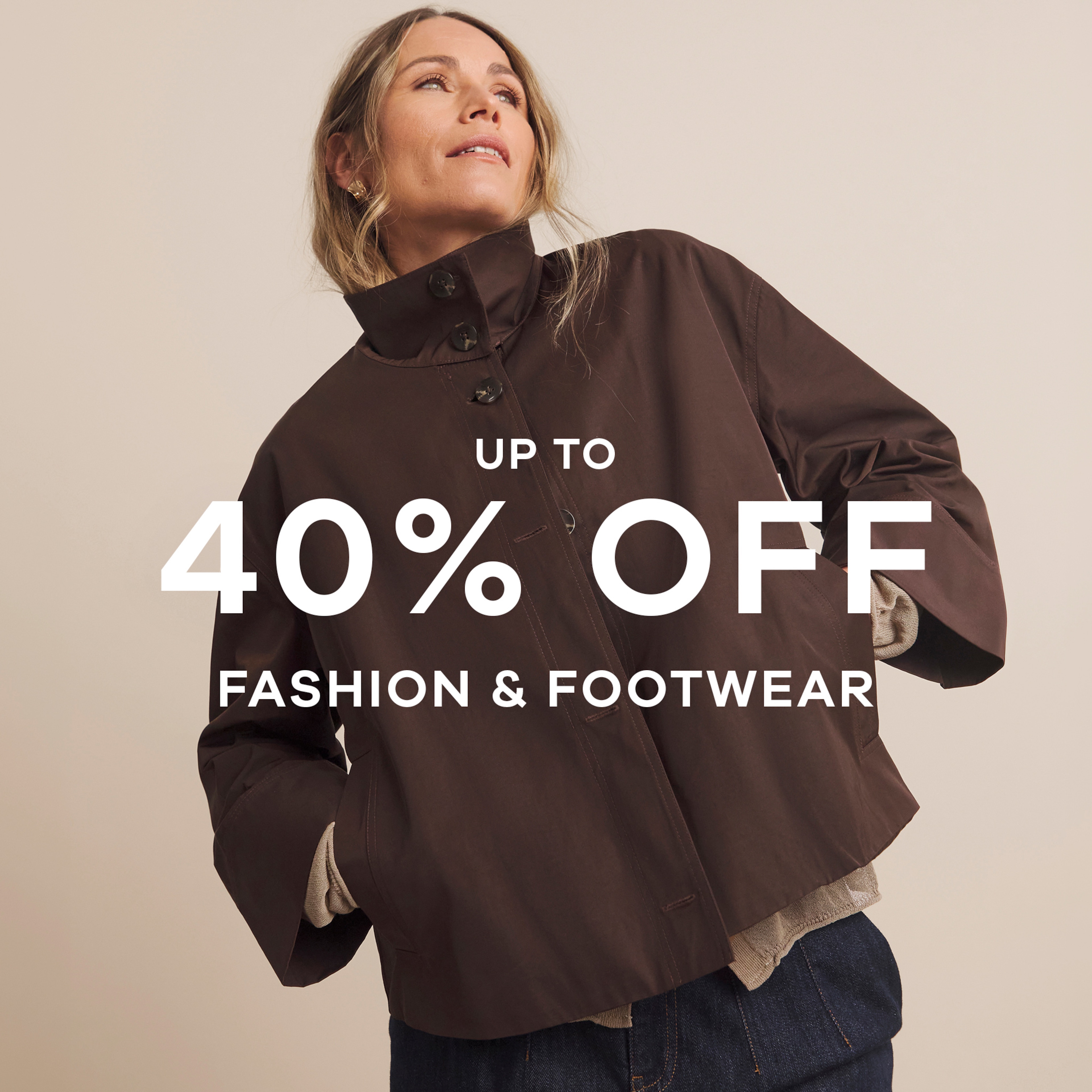 Up to 40% off fashion and footwear text on top of a woman wearing a brown jacket.