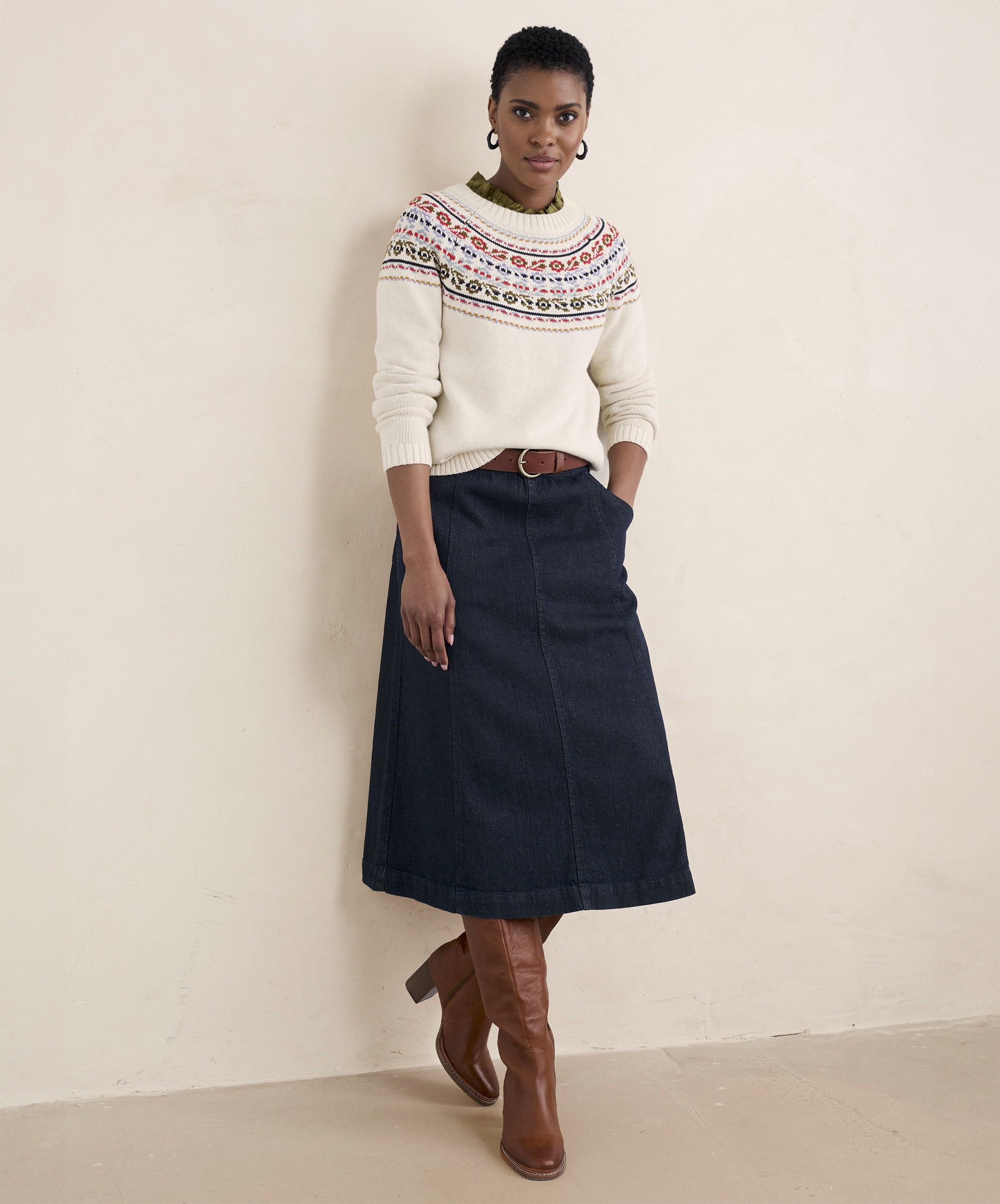 Woman in jumper and denim skirt