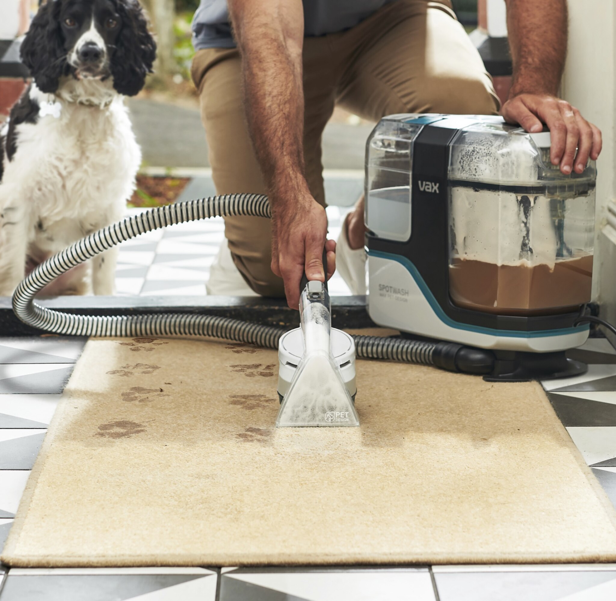 A man using a VAX Spot
washer