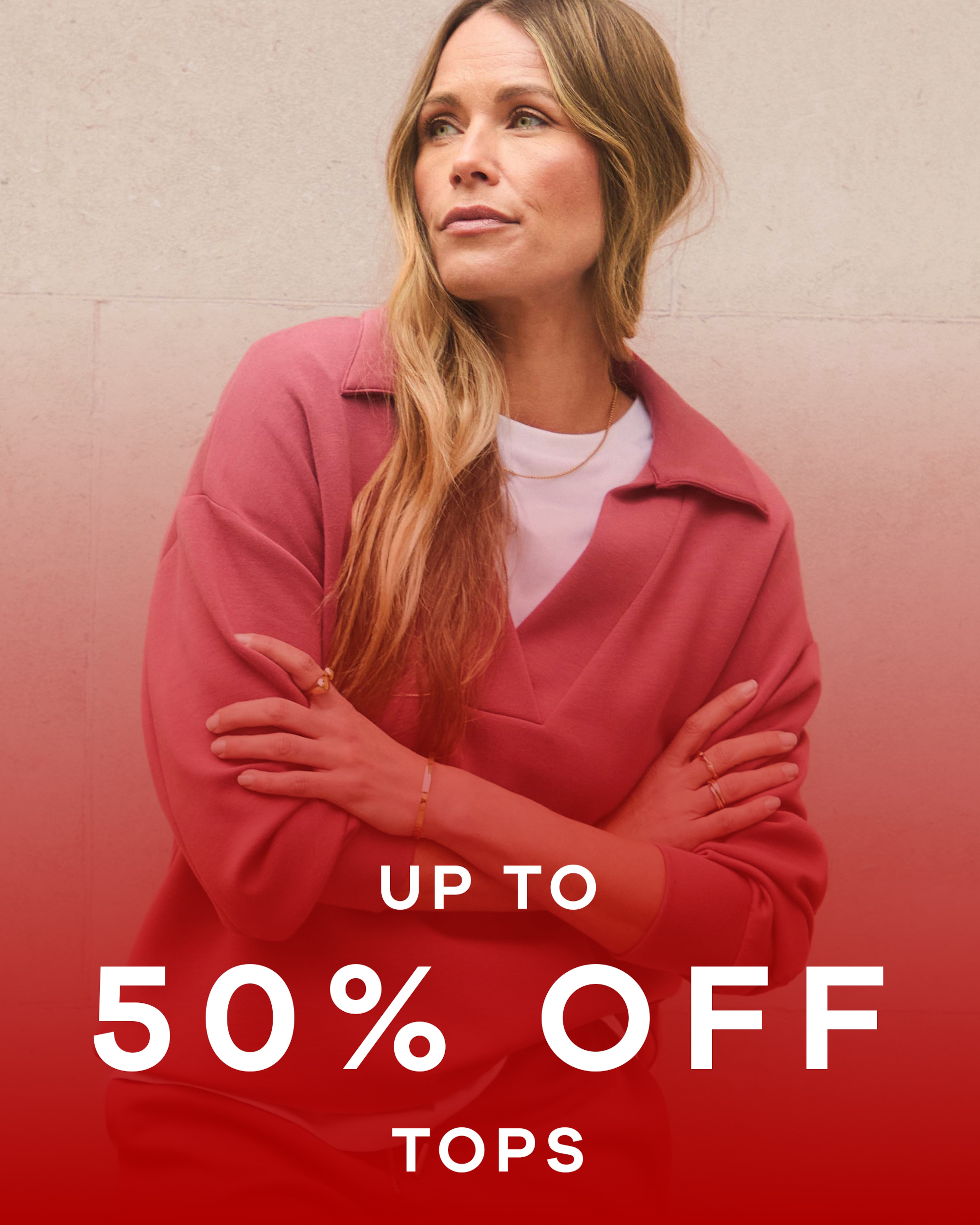 Up to 50% off tops text overlaid on an image of a lady wearing a casual top with a red overlay on the image