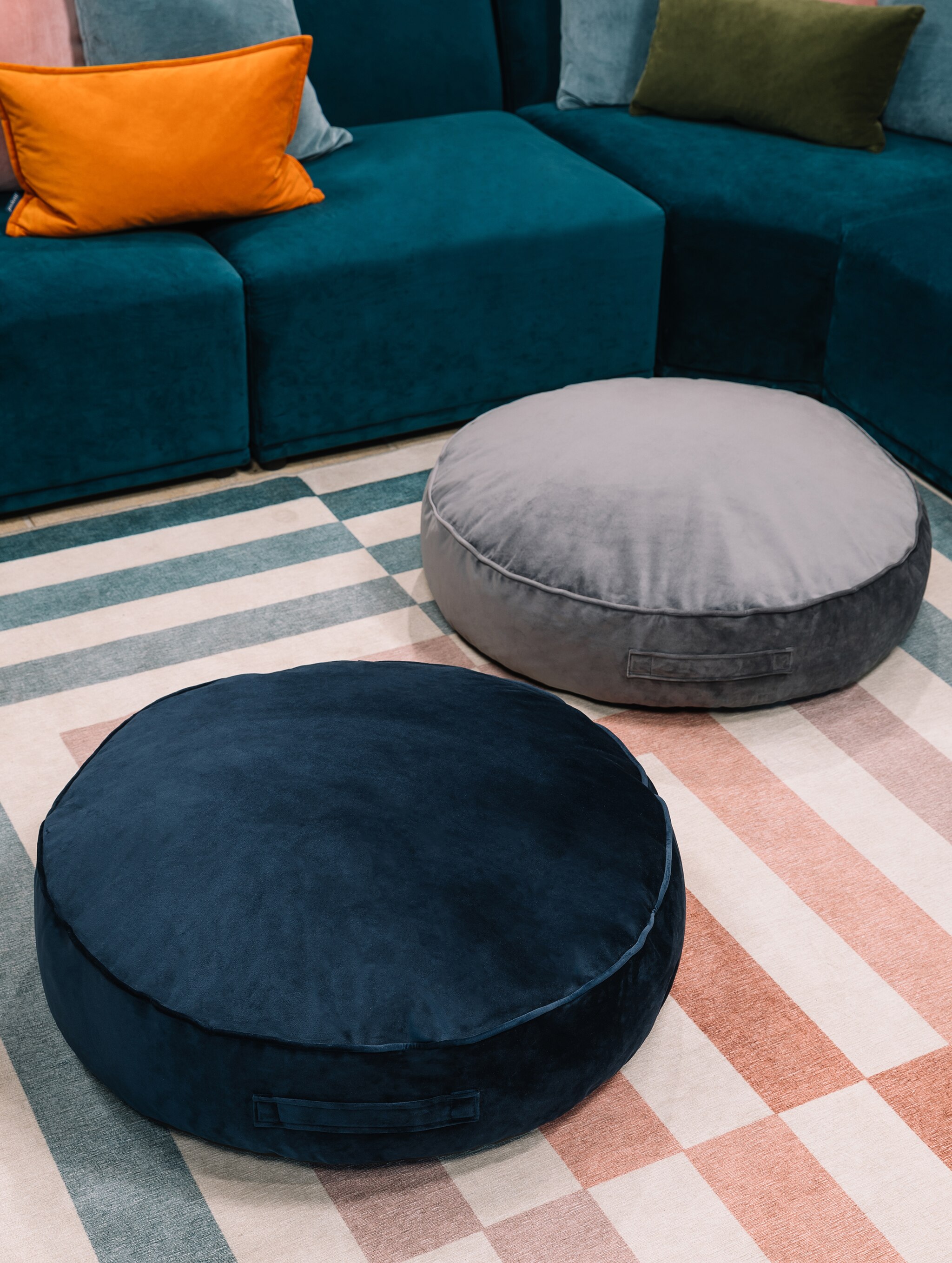 2 round floor cushions