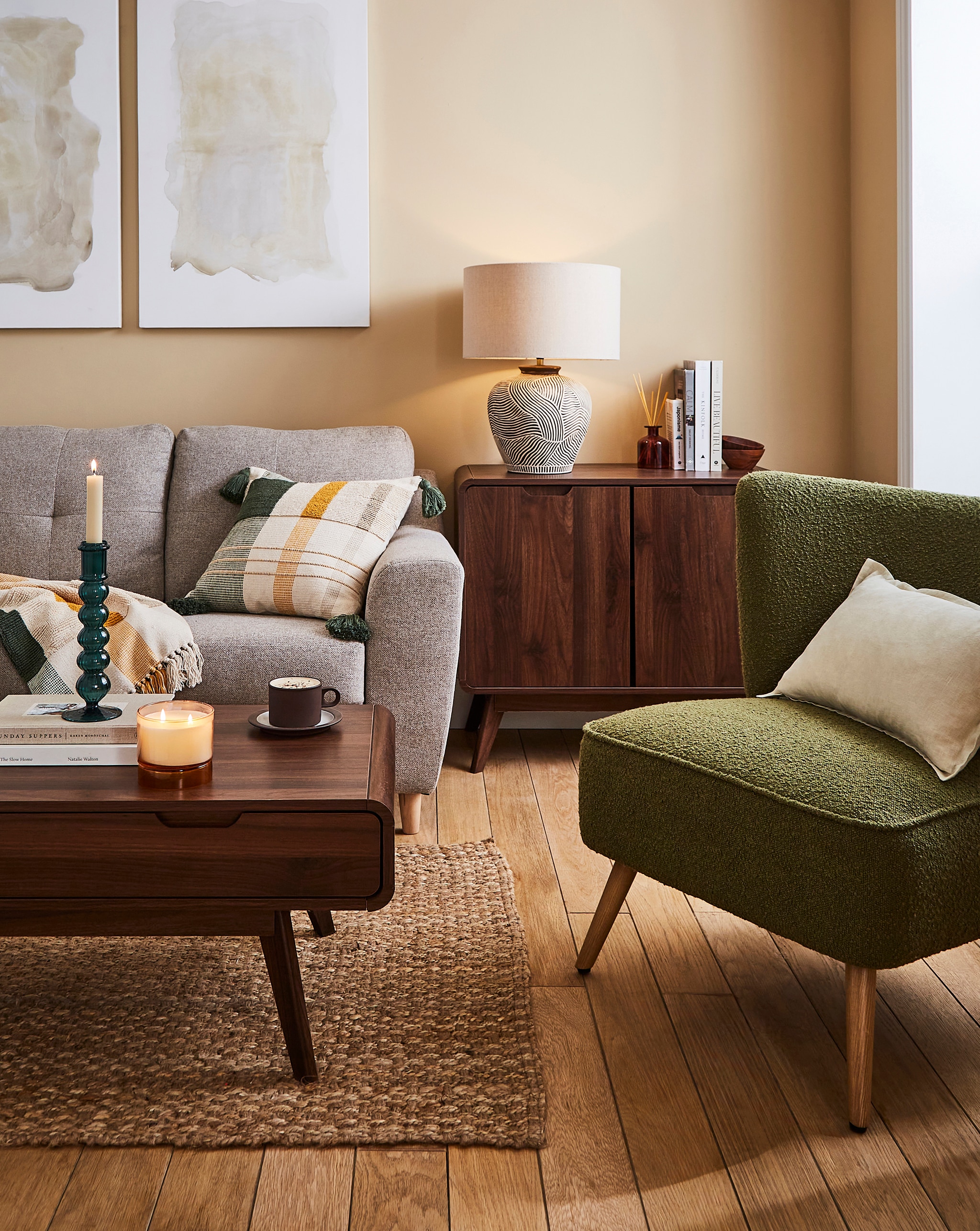 Lounge scene with a coffee table, green armchair and grey sofa