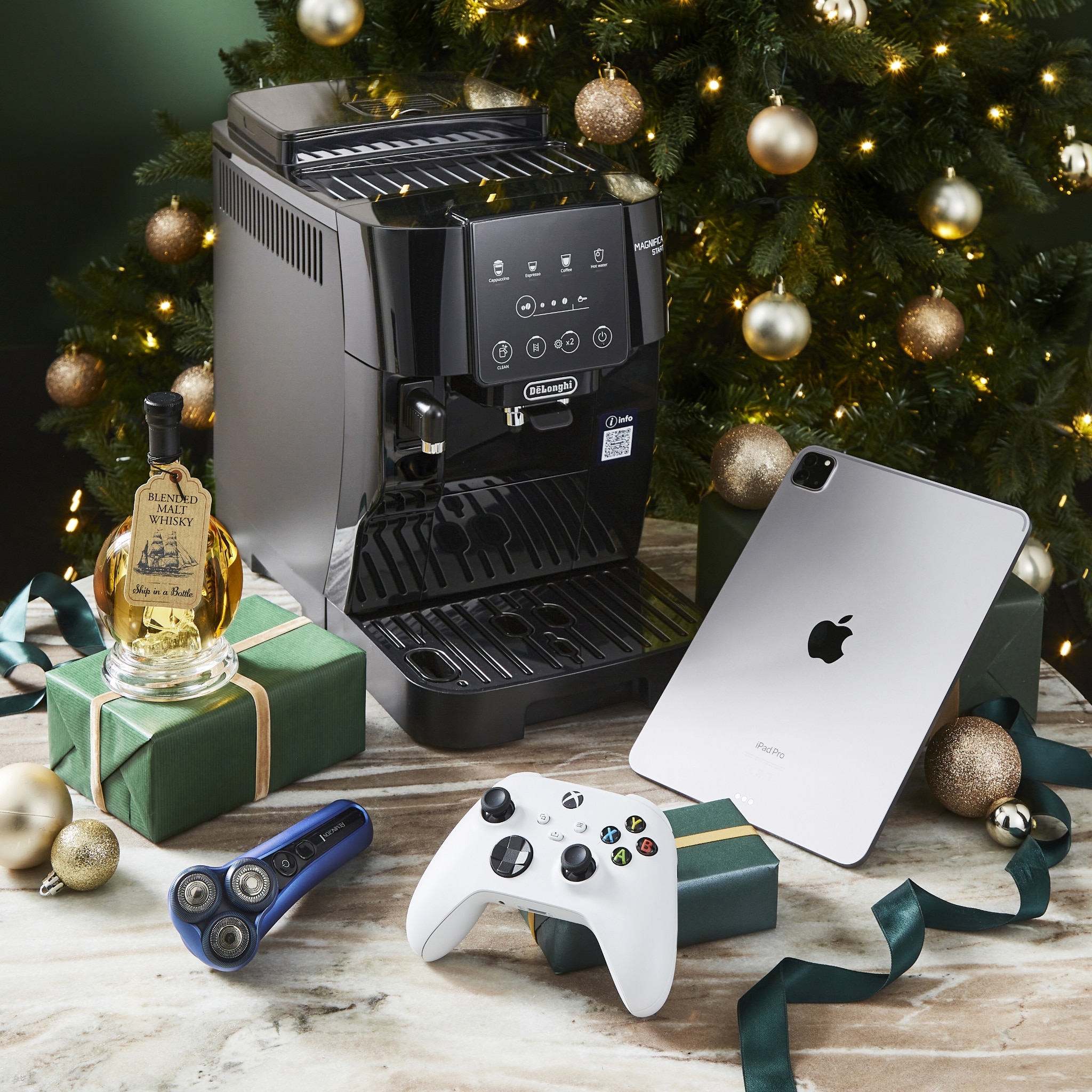 Festive Home Office Scene With Espresso Machine, iPad Pro, Gifts And Christmas Tree Decor