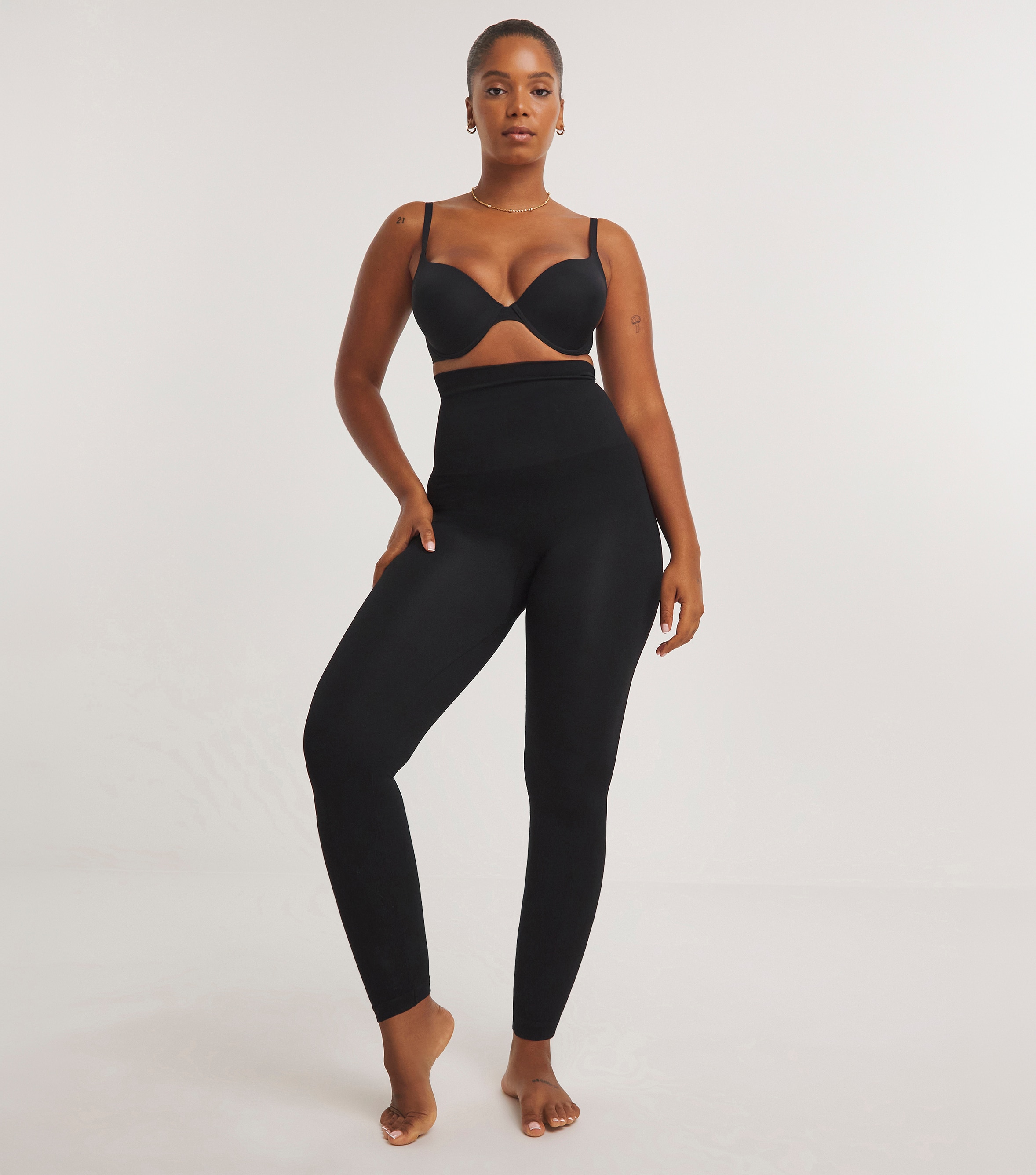 A lady wearing MAGISCULPT Firm Control Ankle Length High Waist Shapewear Leggings