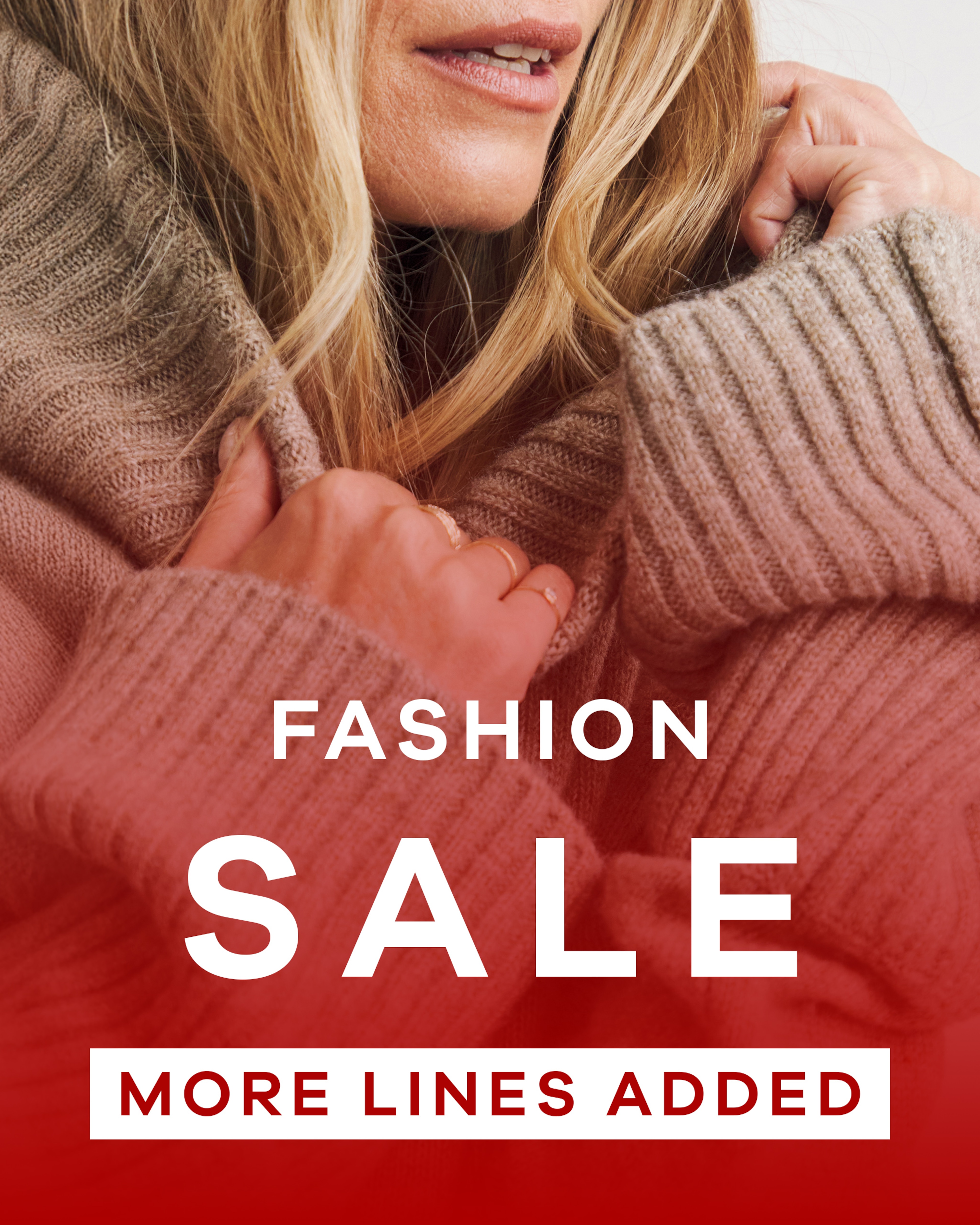 Fashion sale, more lines added. A close up image of a lady huddled up with a knitted jumper.
