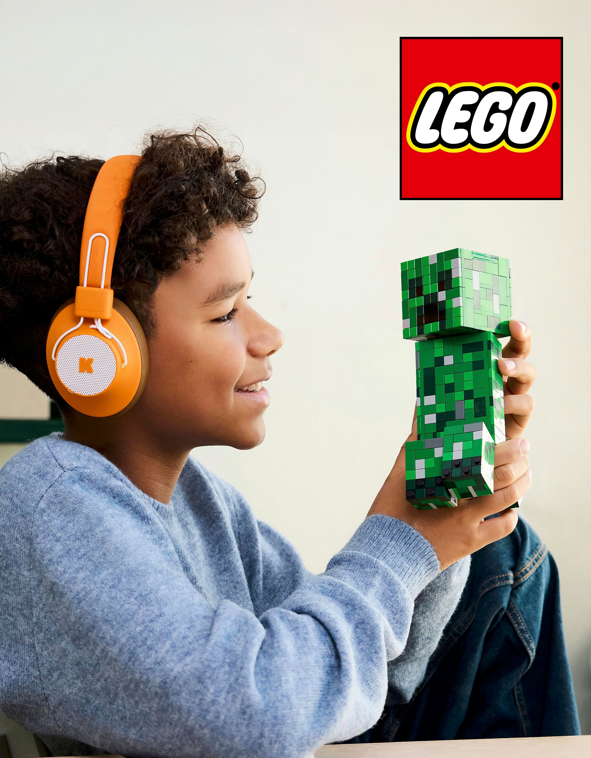 A child playing with a LEGO® Minecraft set