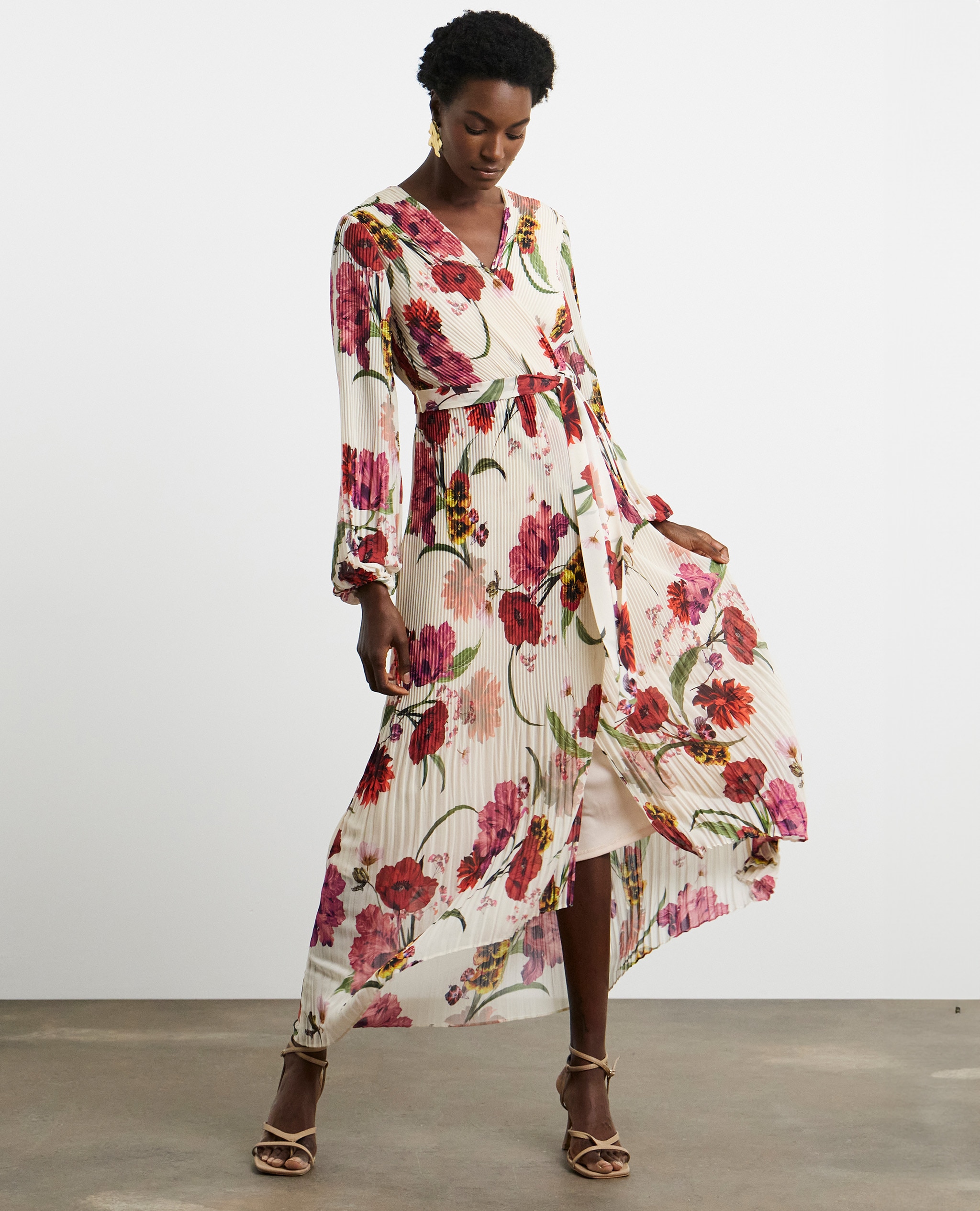 Model wearing a patterned maxi wrap dress