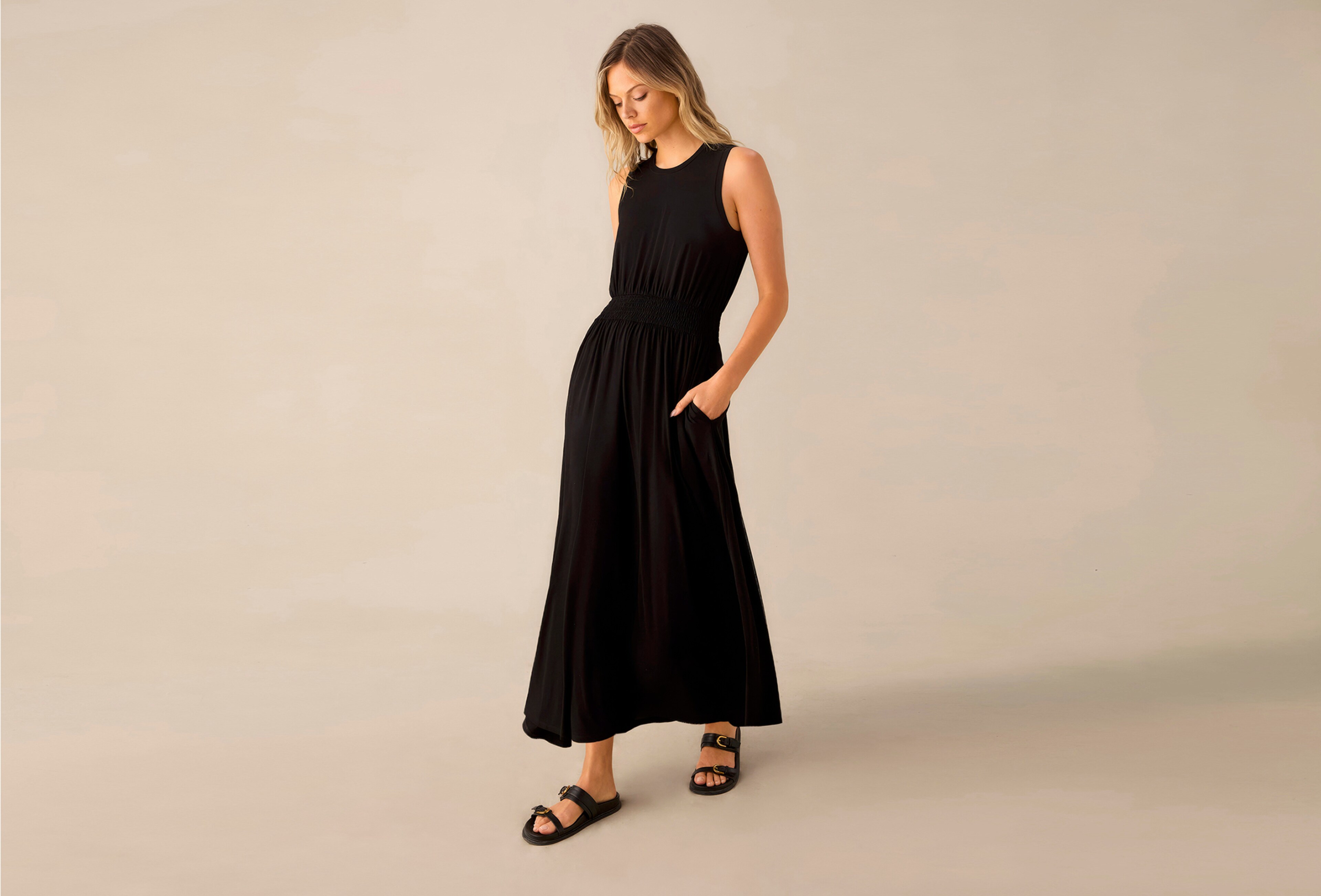 WOMAN WEARING A BLACK MAXI DRESS