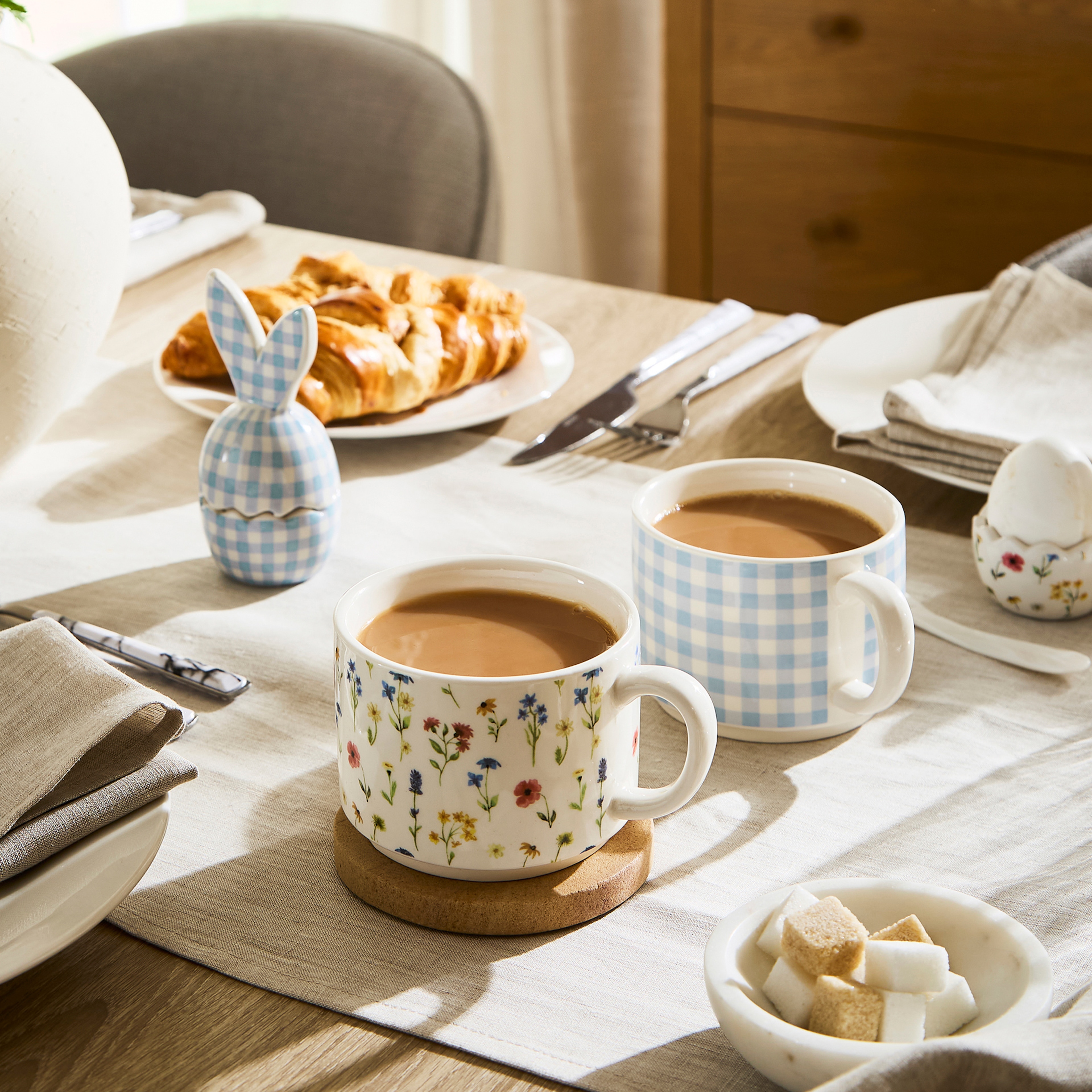 A close up shot of a dining table with Easter themed table decor.