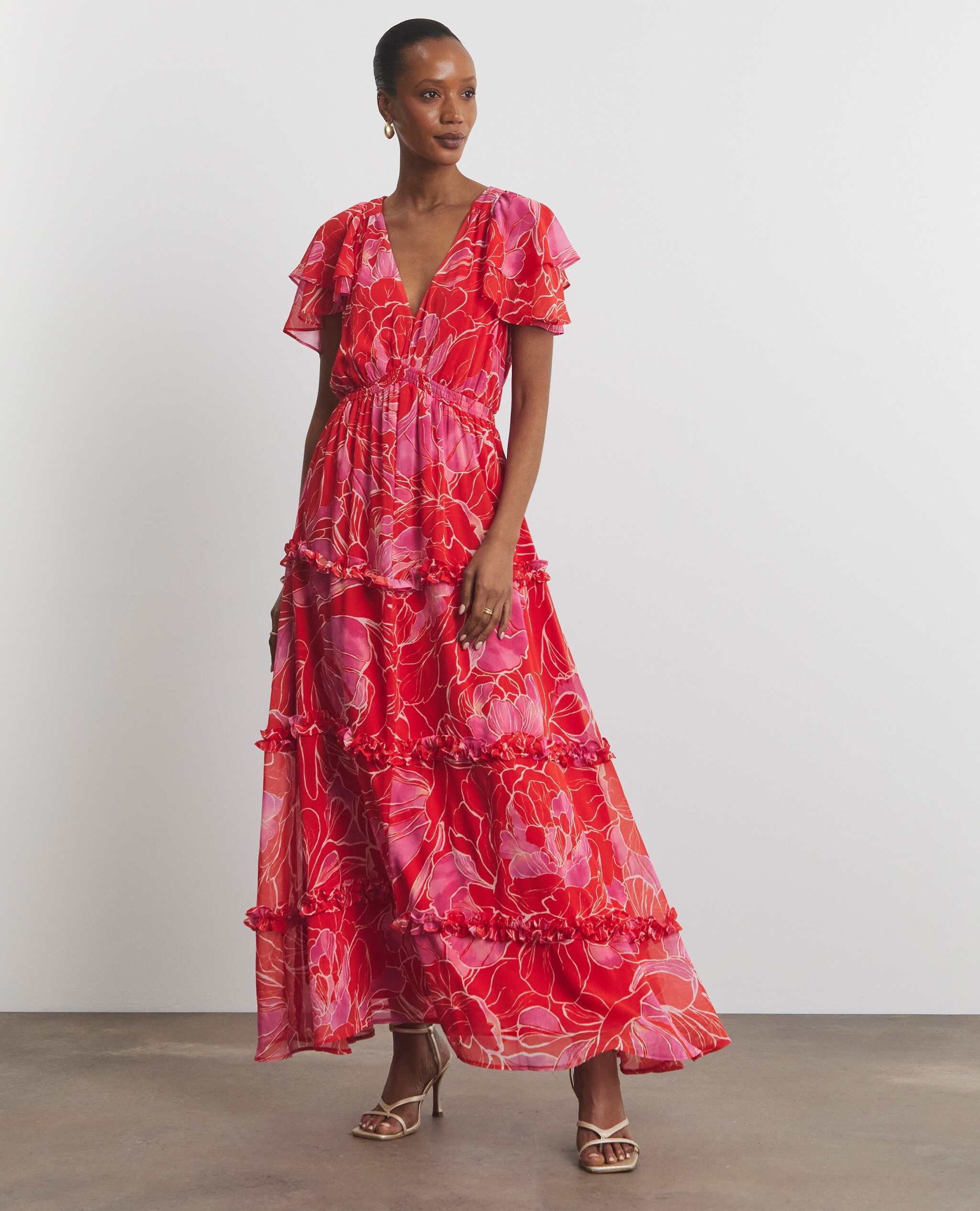 Model wearing a maxi floral pink dress