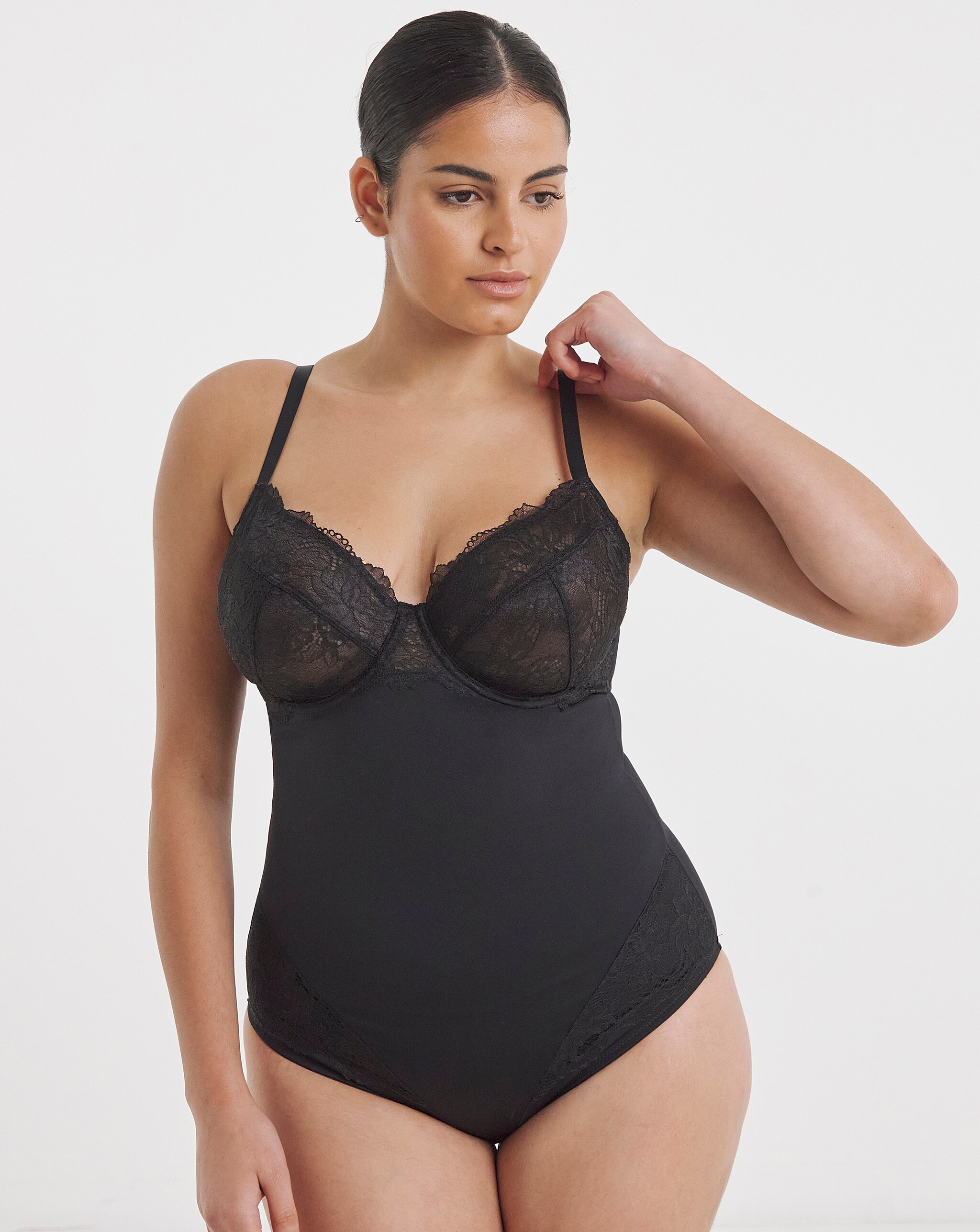 A lady wearing a MAGISCULPT Firm Control New Ella Body Shaper