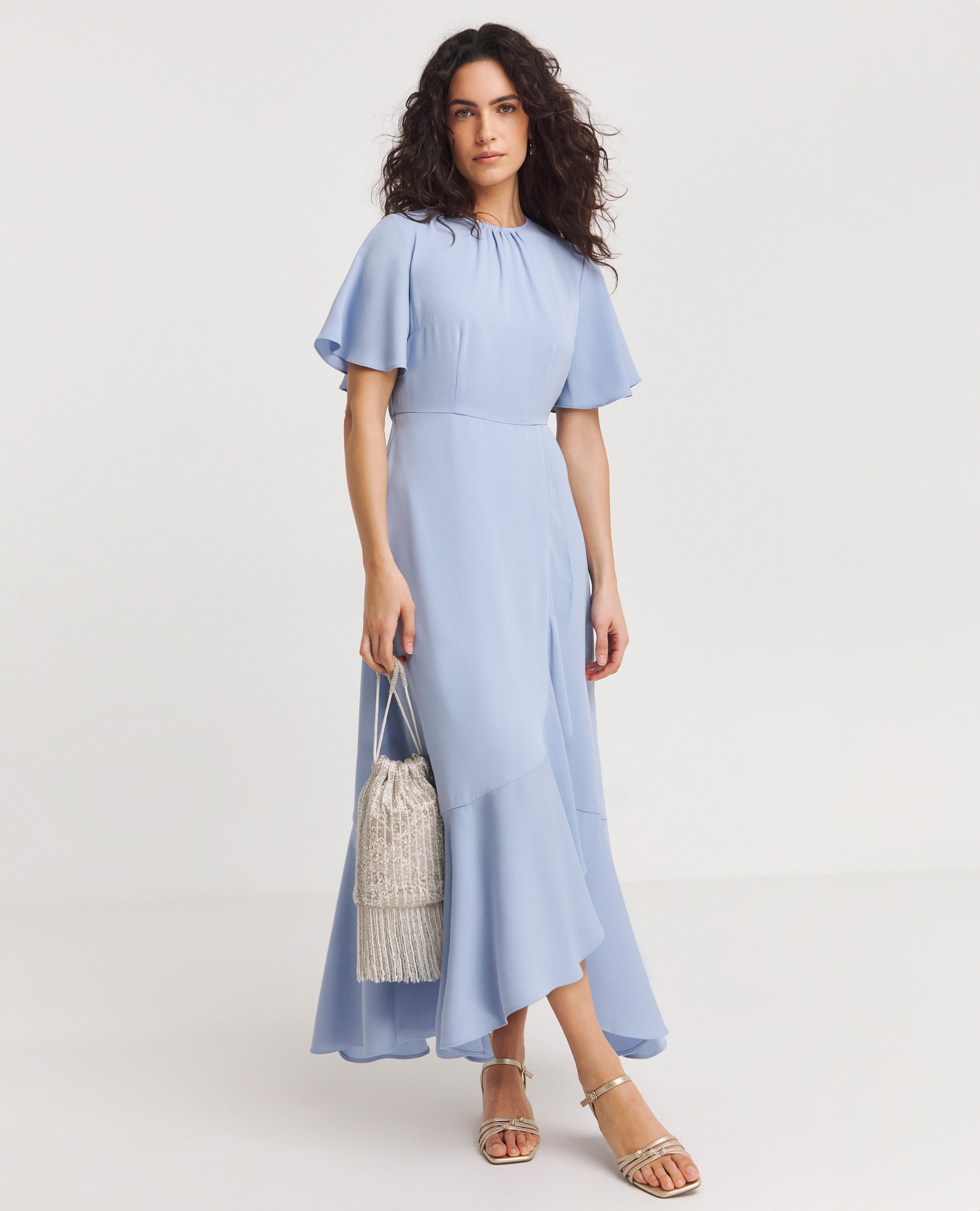 Model wearing a maxi pastel blue dress