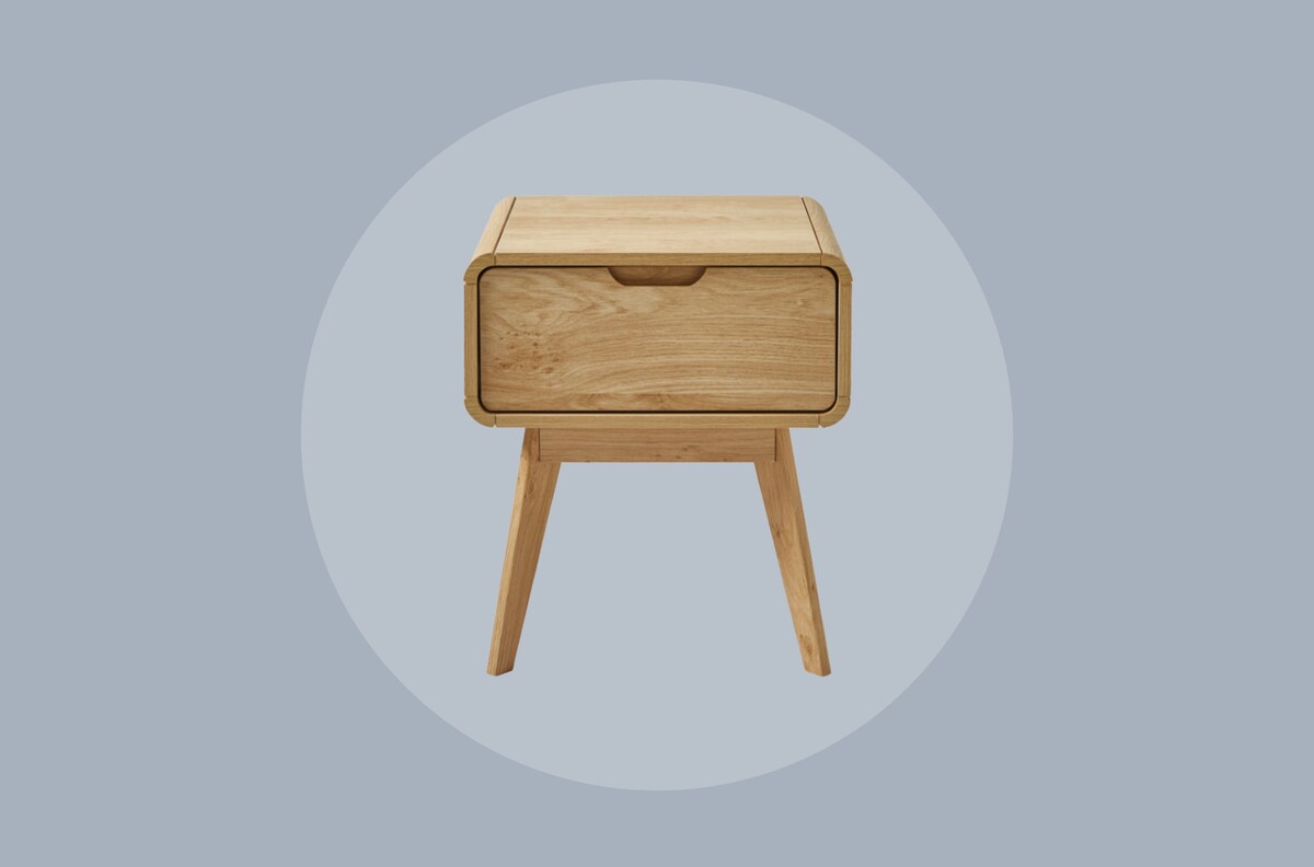 A wooden table on a pale grey blue background