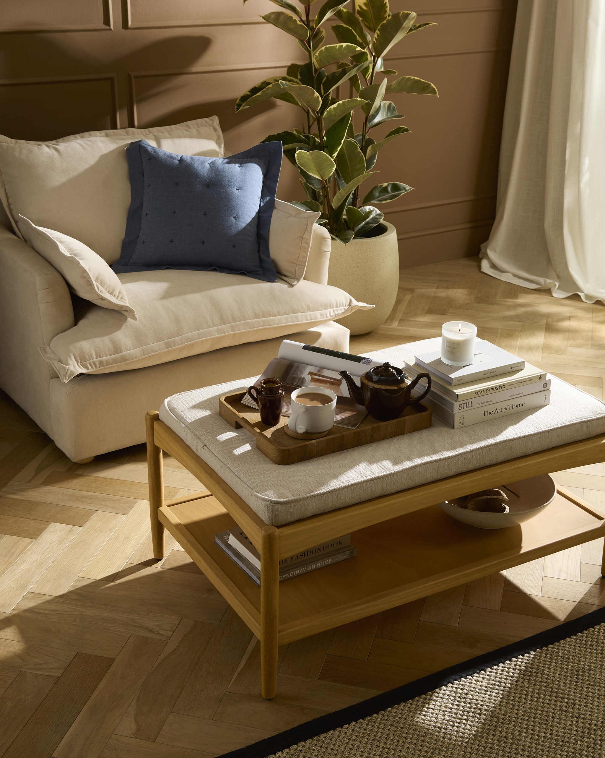 A living room scene with a sofa and coffee table.
