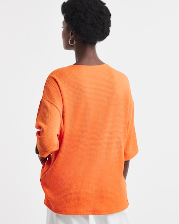 Orange Textured V-Neck Zip Front Short Sleeve Longline Top